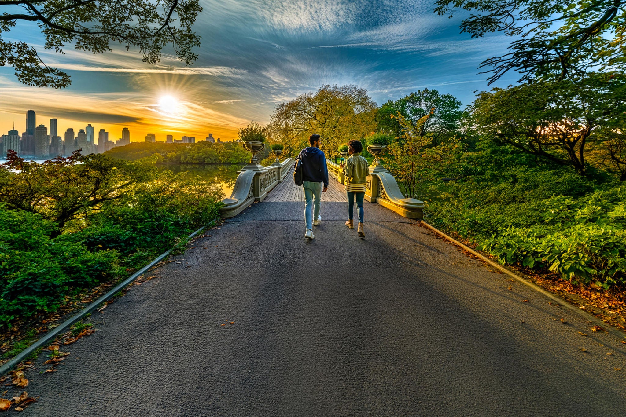 People walk along the roads to the parks on a sunny spring day. 