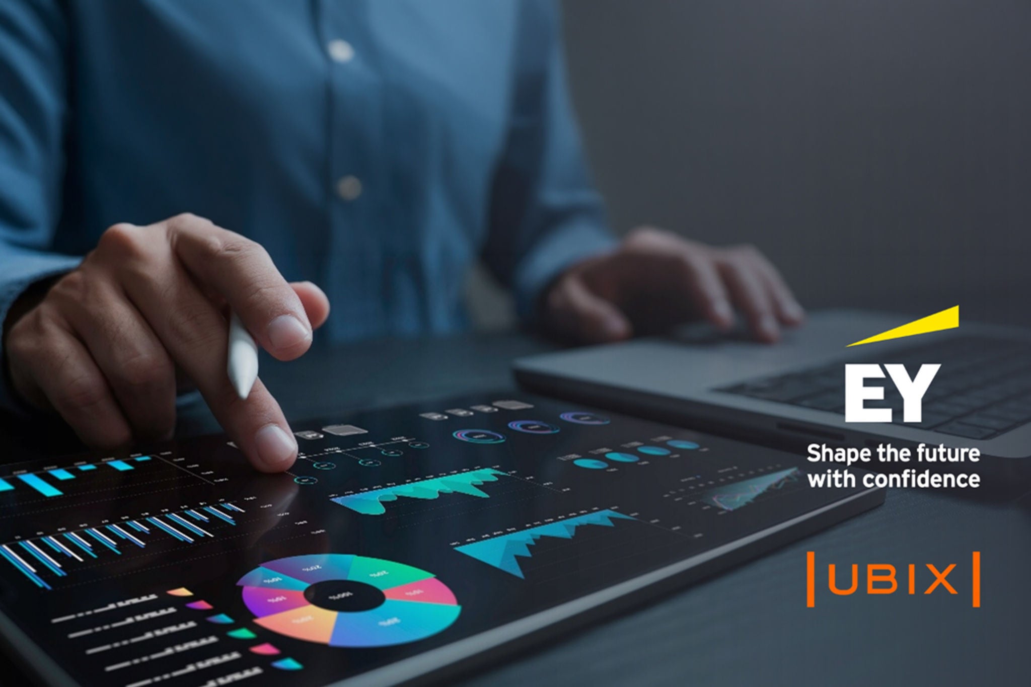 Man working on laptop while sitting in kitchen at home