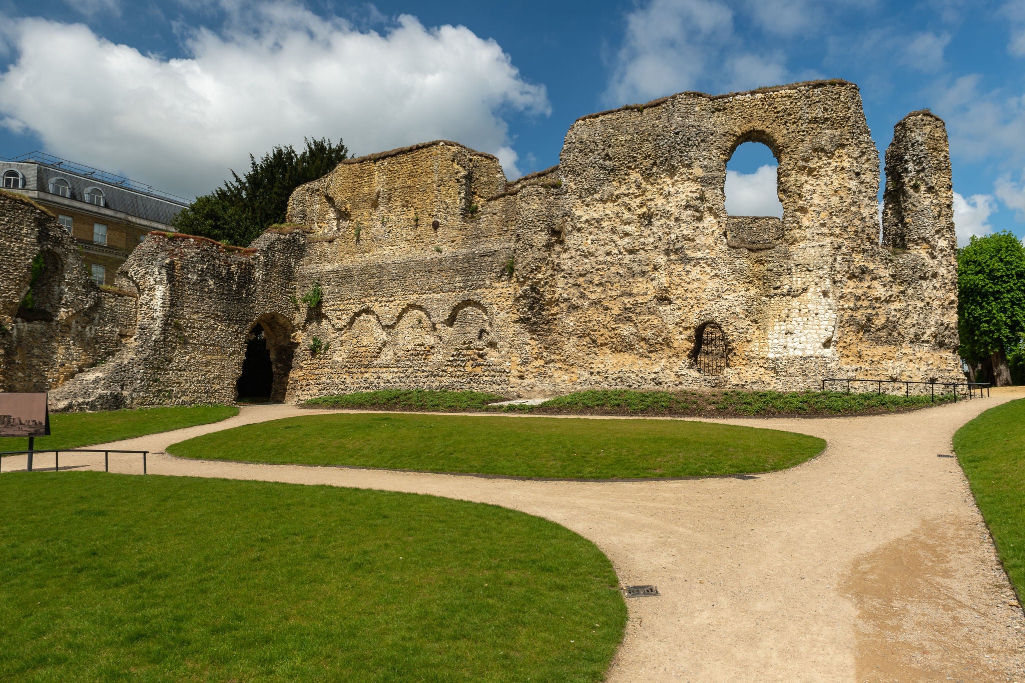 Stone ruins and pathways at Reading Abbey on a clear day