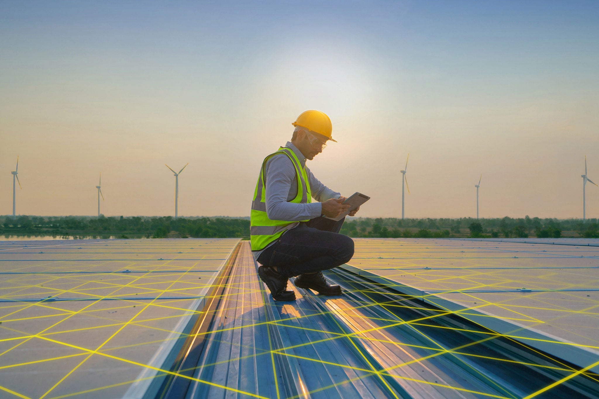 Portrait of engineer man or worker, people, working on solar panels or solar cells on the roof in factory industry. Power plant, renewable energy source. Eco technology for electric power. Maintenance