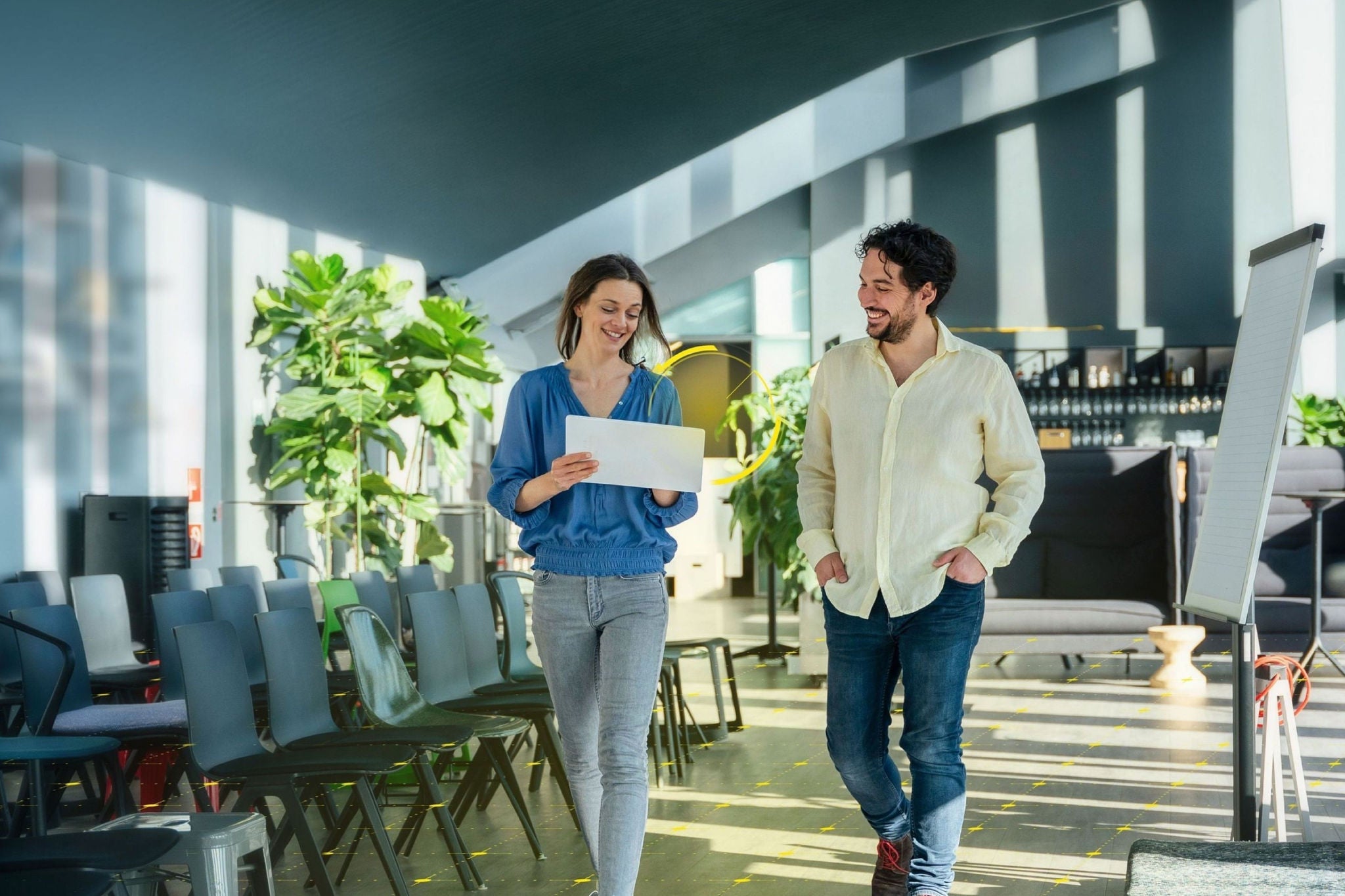 Two professional talking about AI in the office