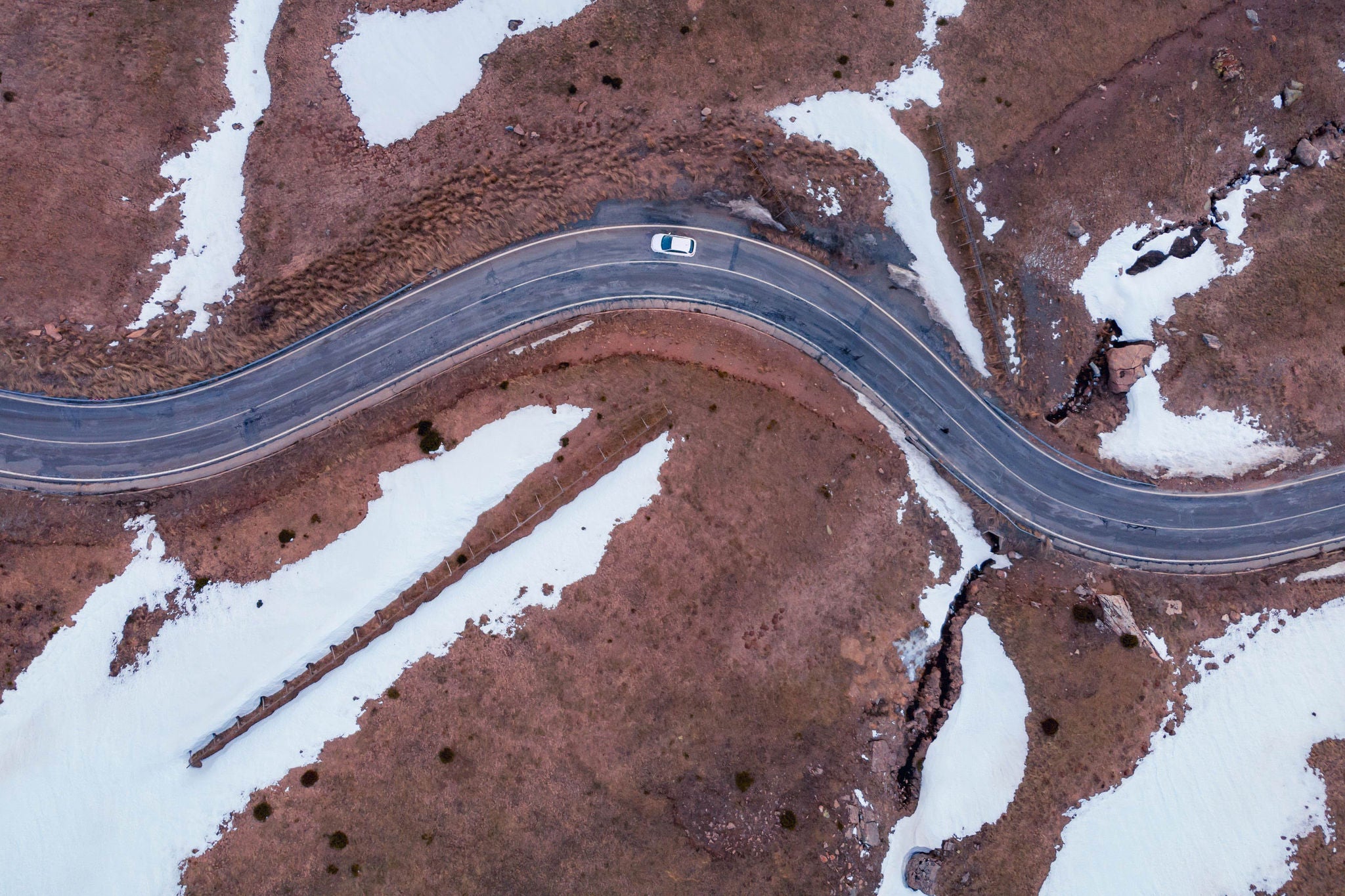 Aerial view of road amidst snow