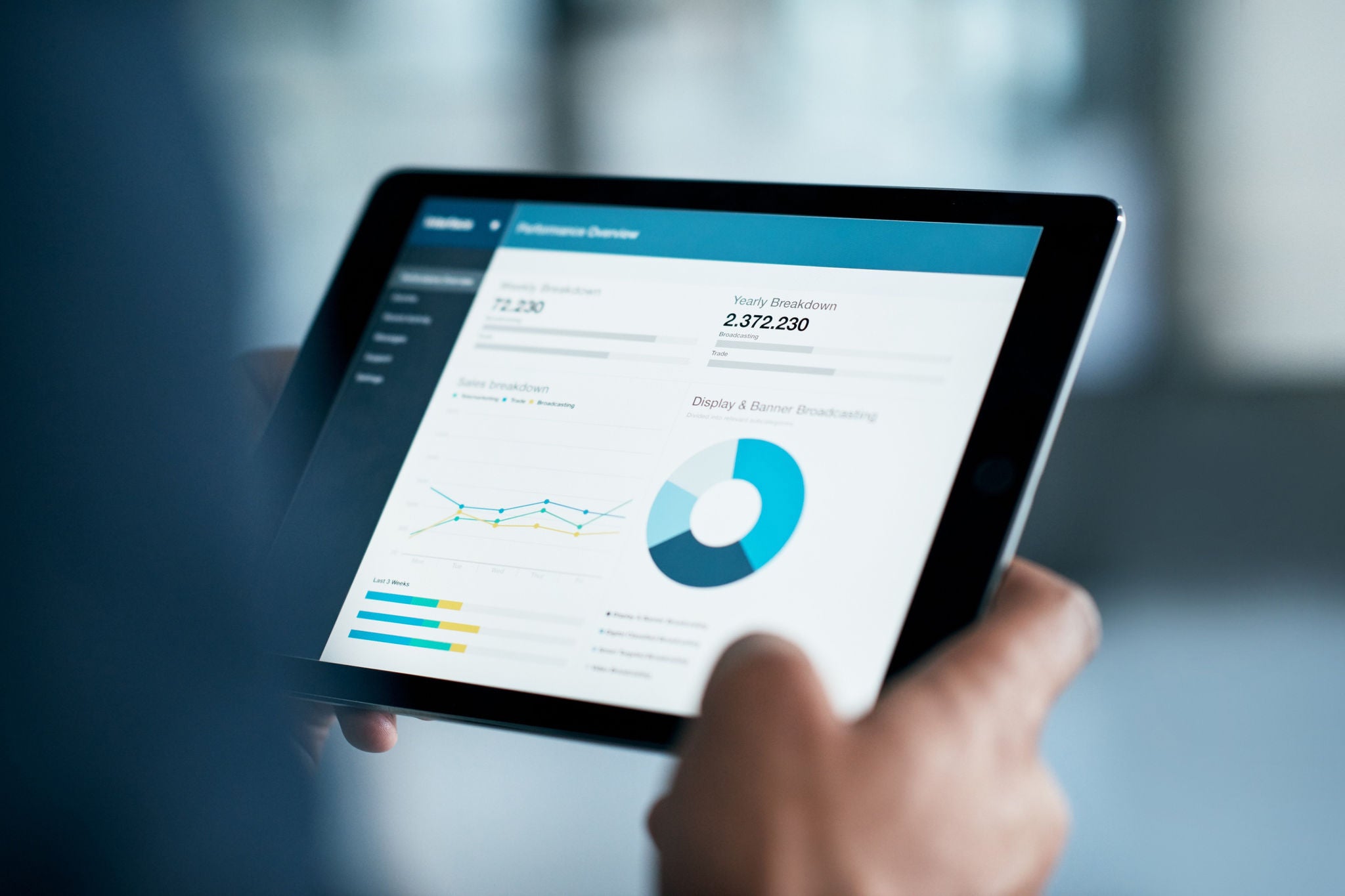 person looking at data on a tablet