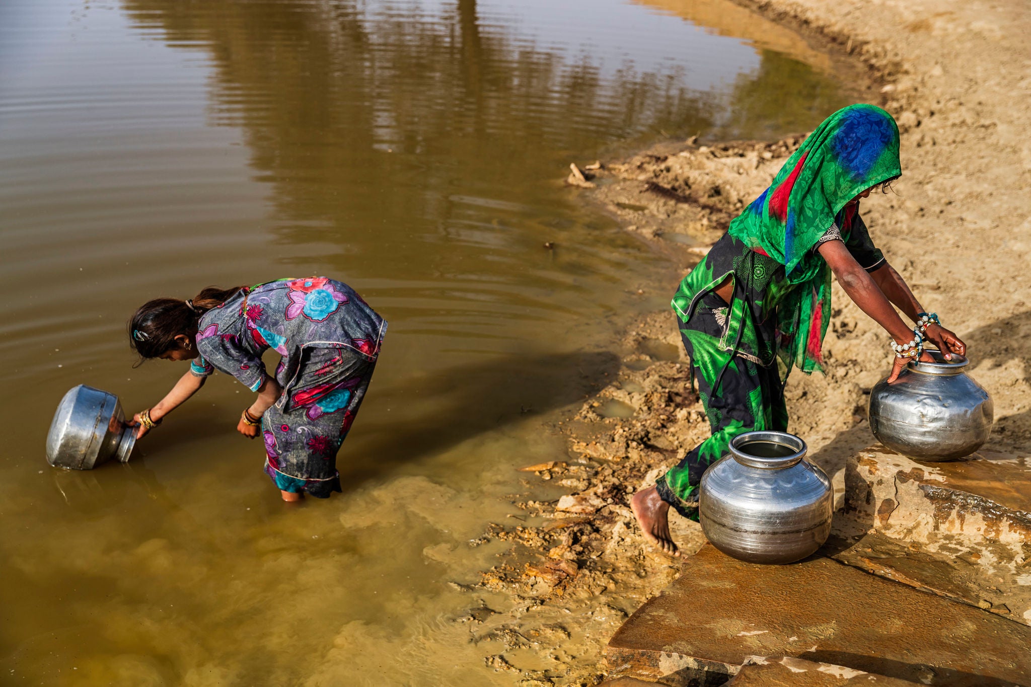 Girls collecting water