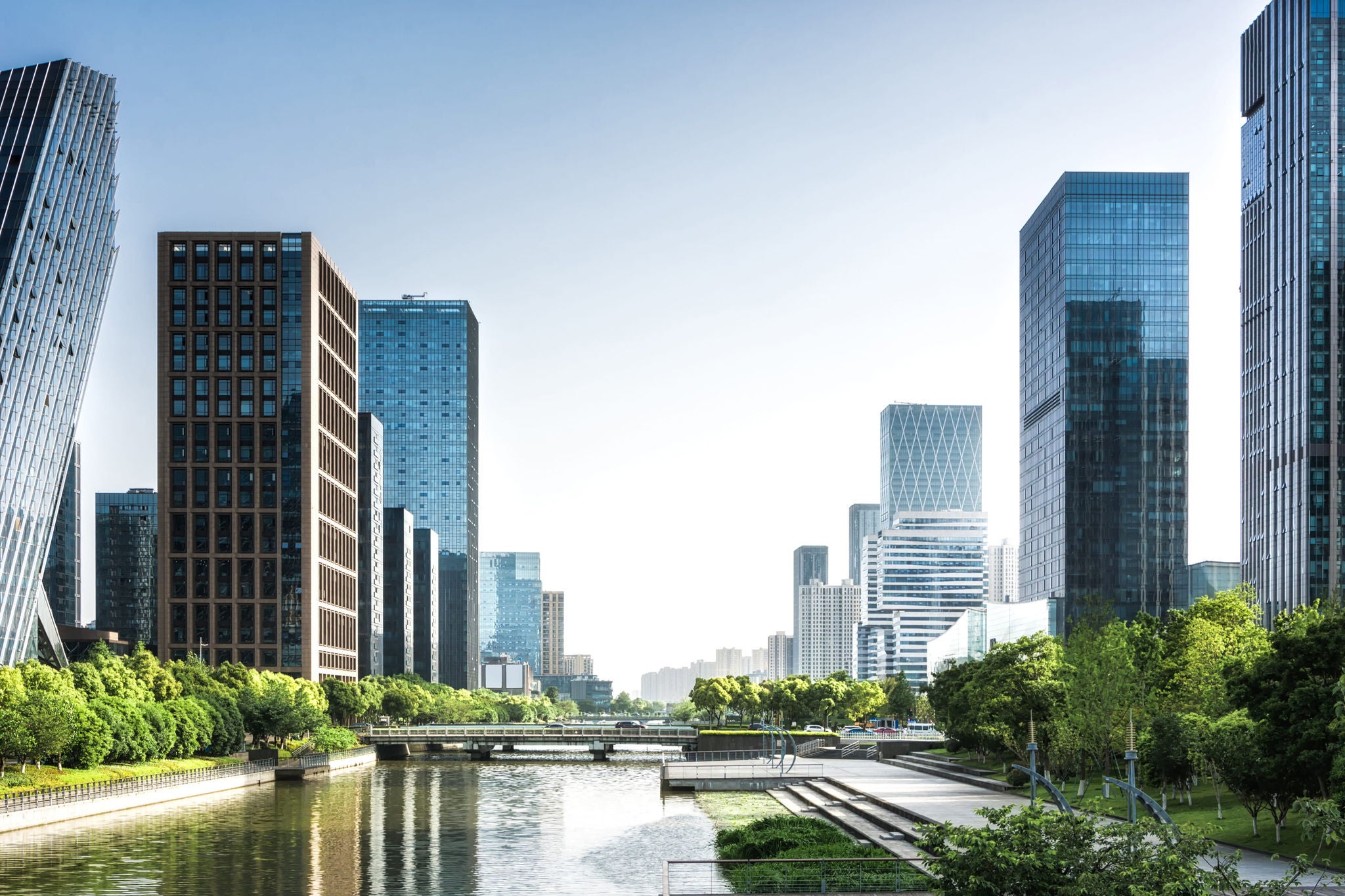 Man working on laptop while sitting in kitchen at home