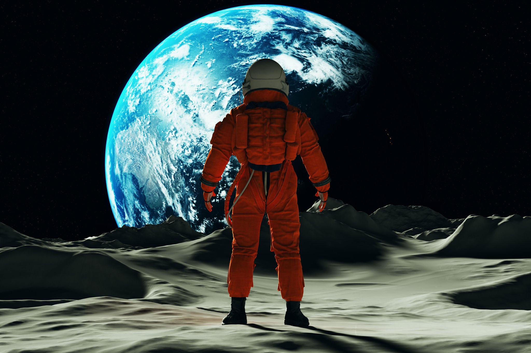 Astronaut man on the Moon in an Orange Space Suit Looking Towards Earth