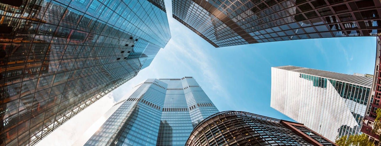 Bottom shot of buildings looking up the sky