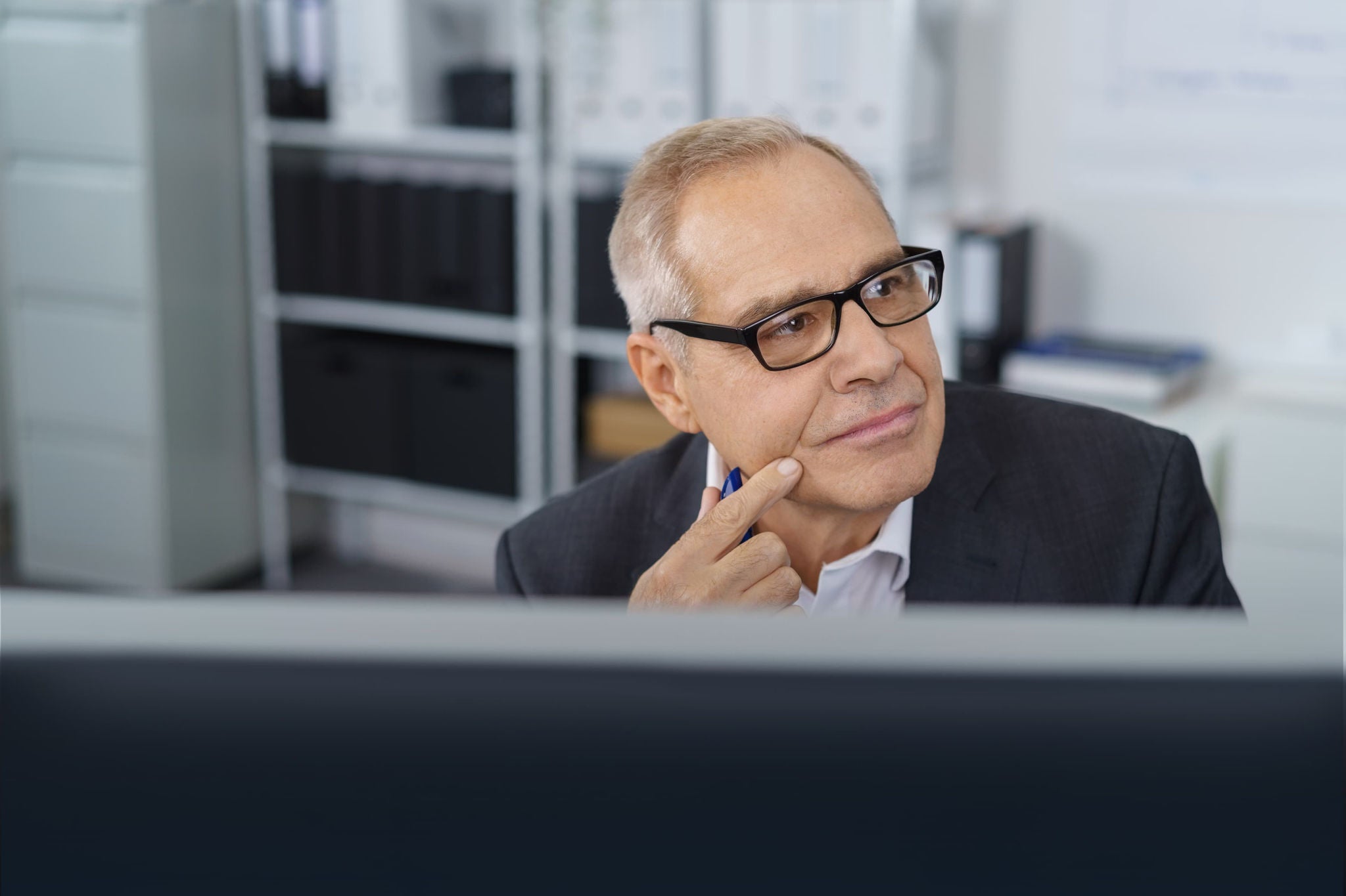 Person is sitting at a desk in an office environment.