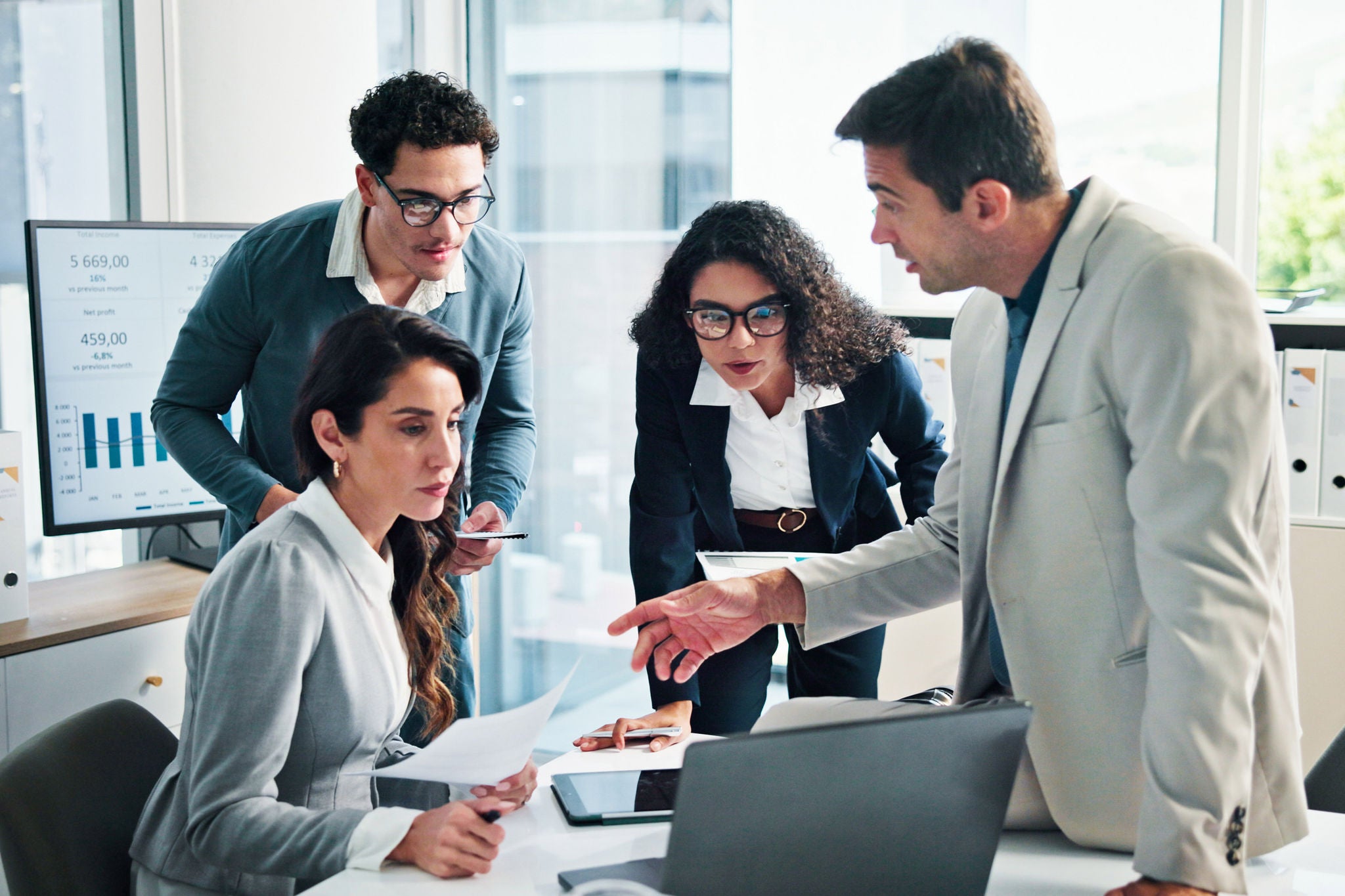 Paperwork, laptop or business people with shareholders in discussion for planning and capital growth. Manager, accounting graphs and financial advisors in meeting with executive directors for budget.