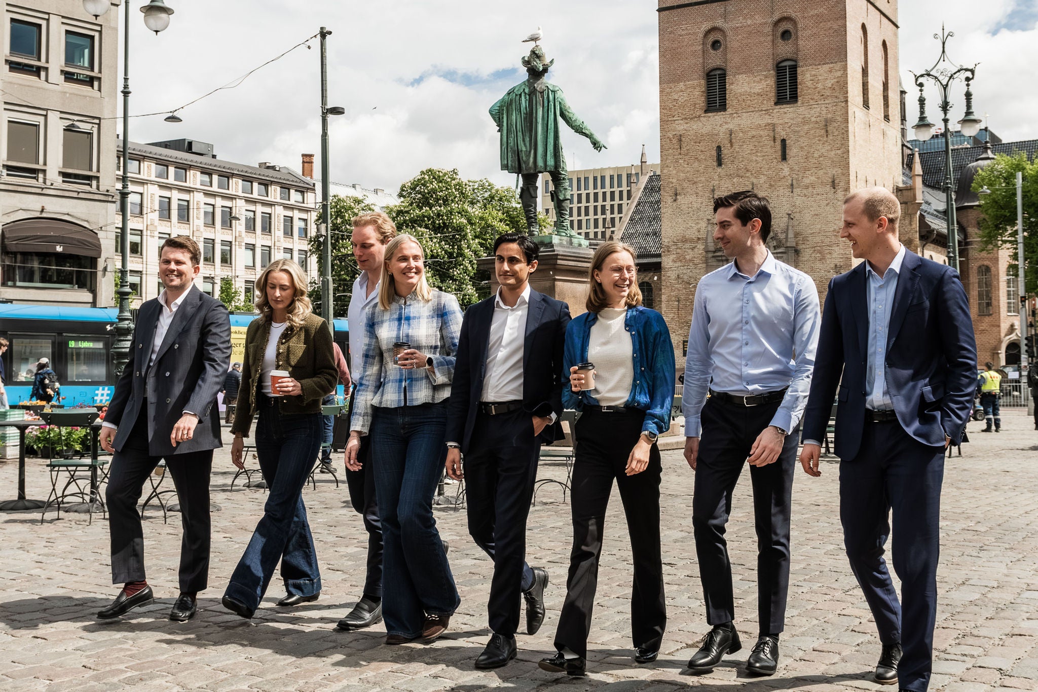 Graduates and early-career professionals networking in the city