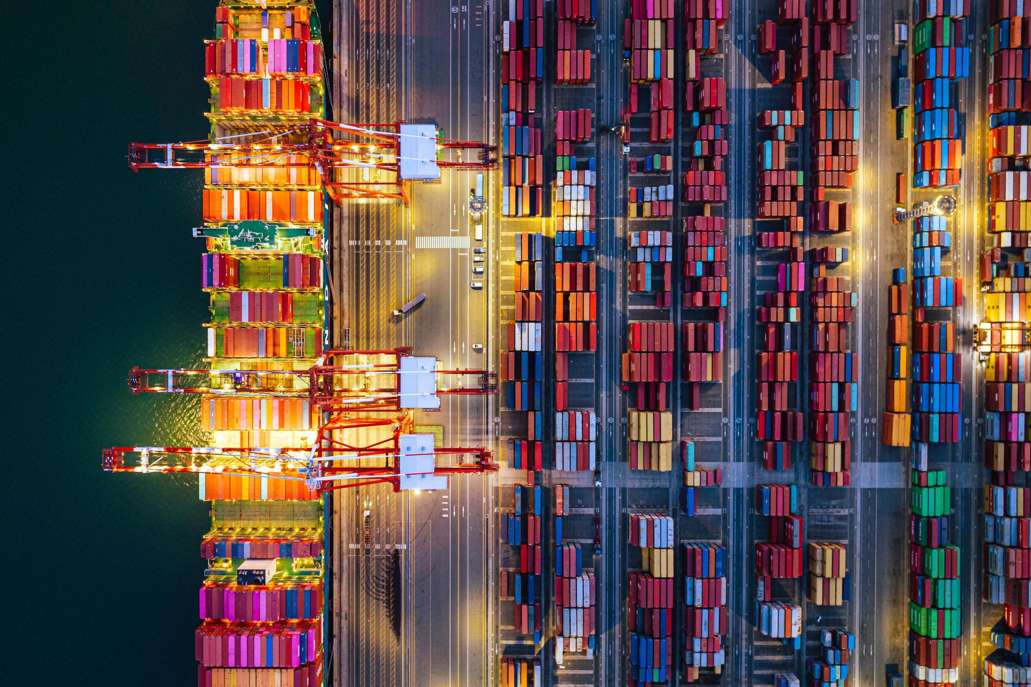 Aerial view of container cargo ship on terminal commercial port