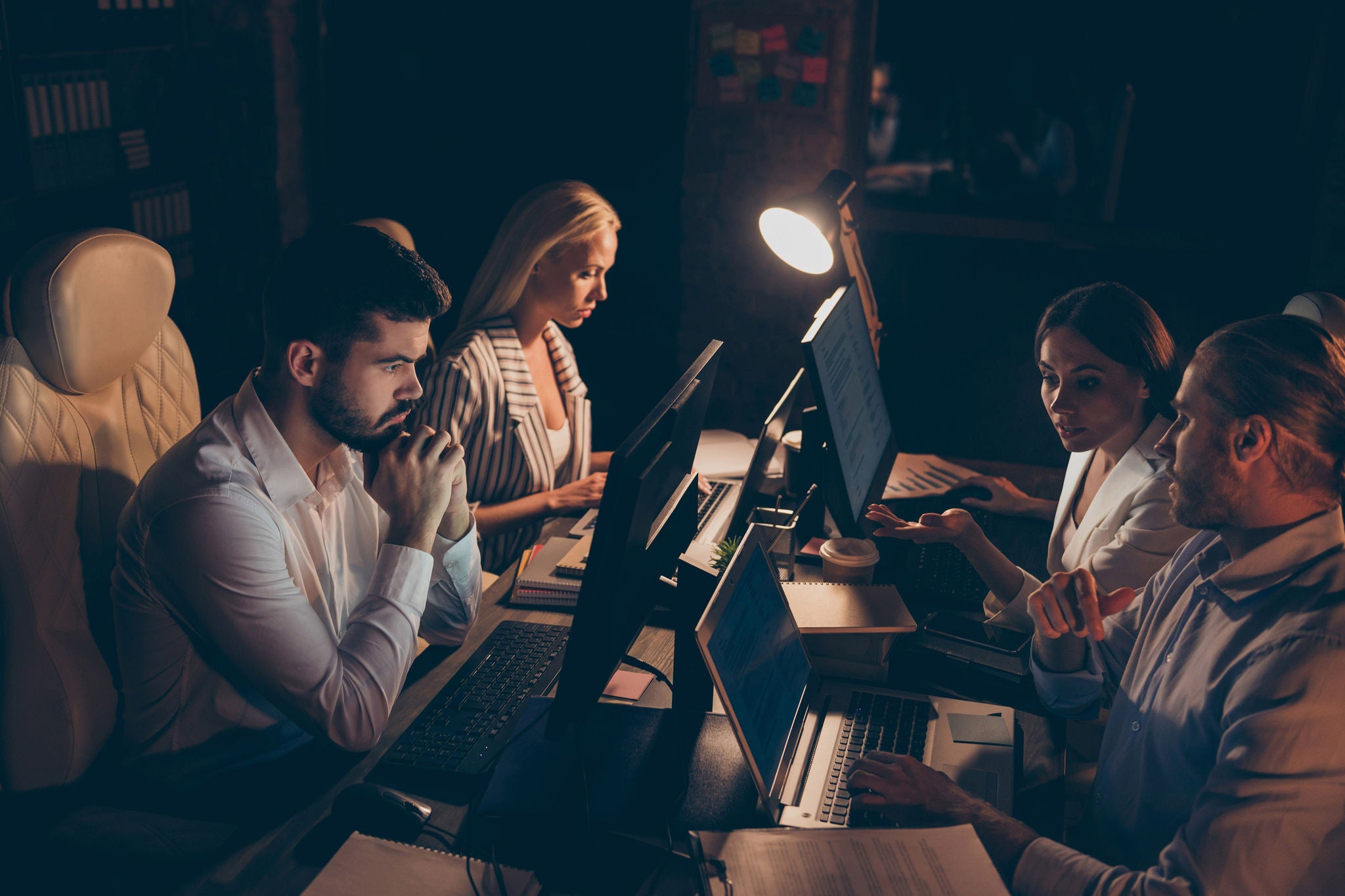 Profile side view of nice attractive professional skilled experienced smart clever, coworkers sharks experts it geek solving tech problem at night preparing report at work place station