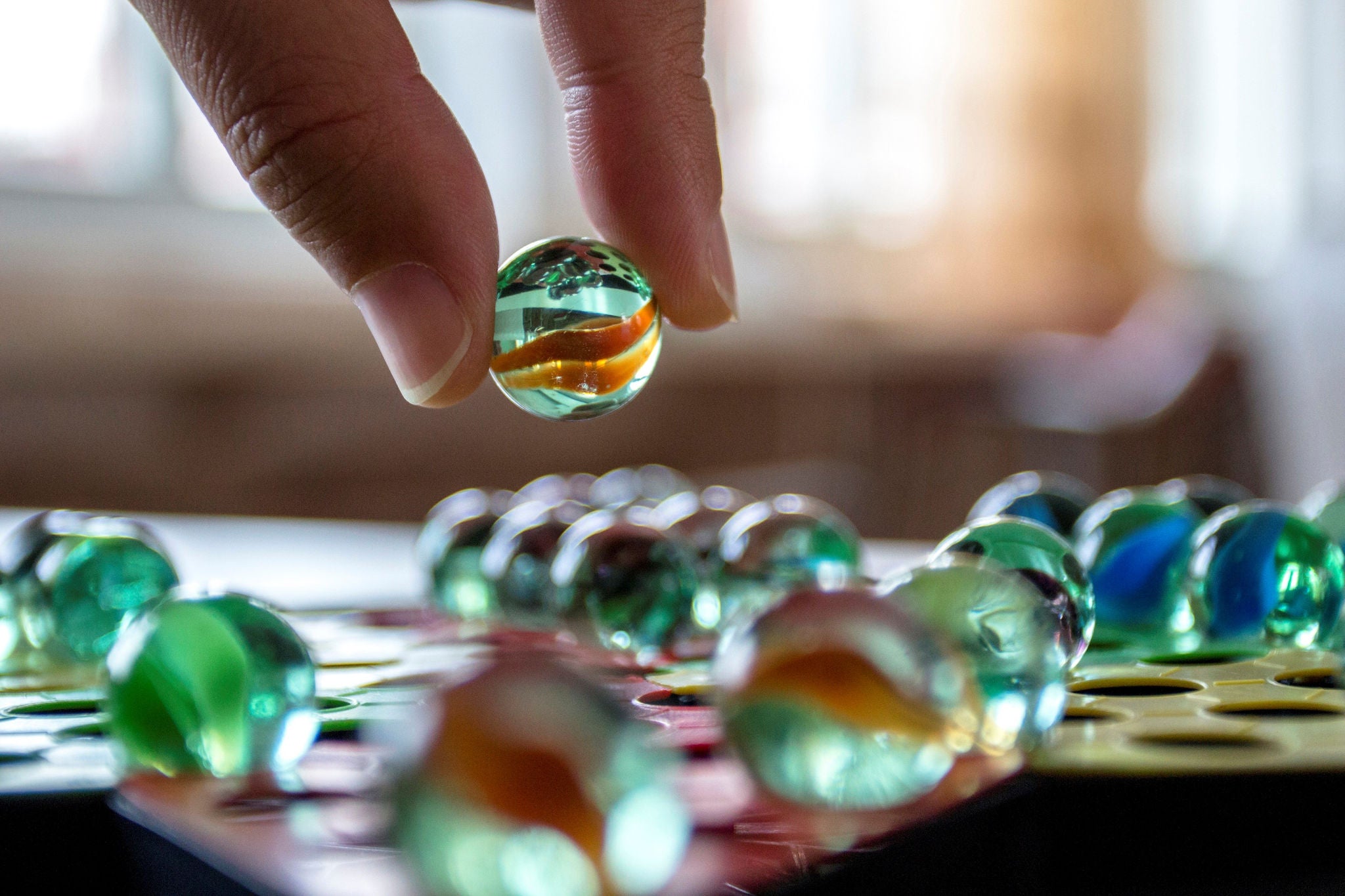 Photo of a handle placing marbels