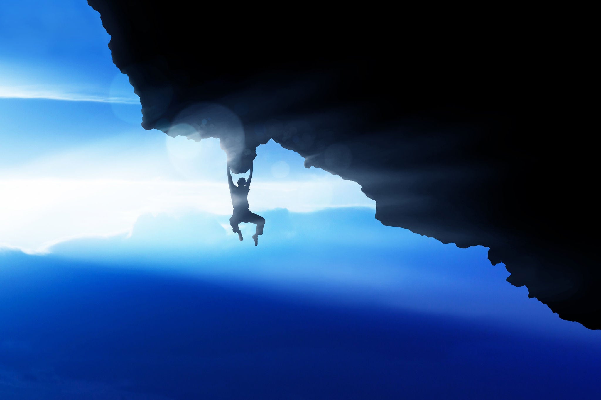 View of a man rock climbing