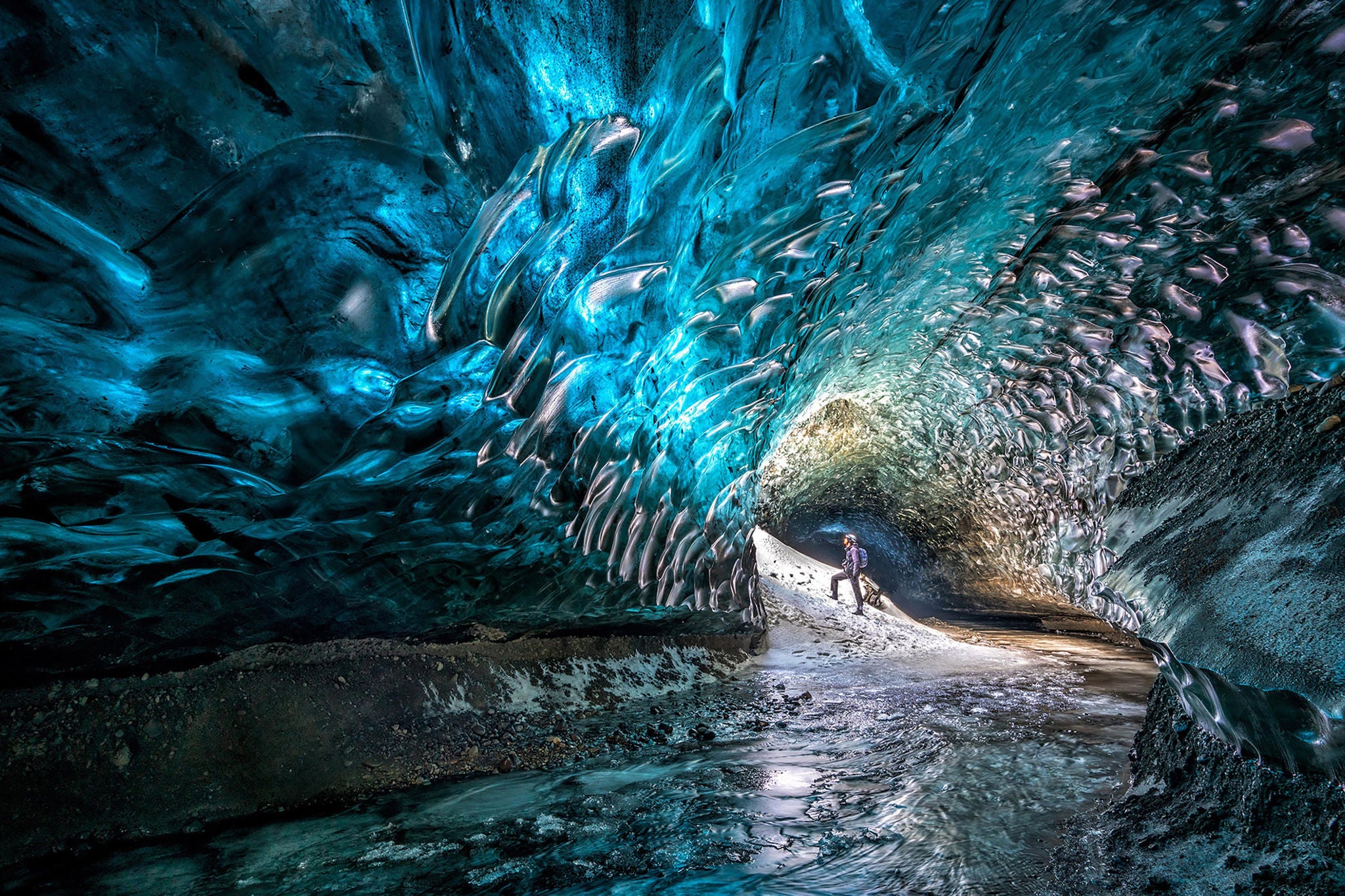Man standing in frozen cave