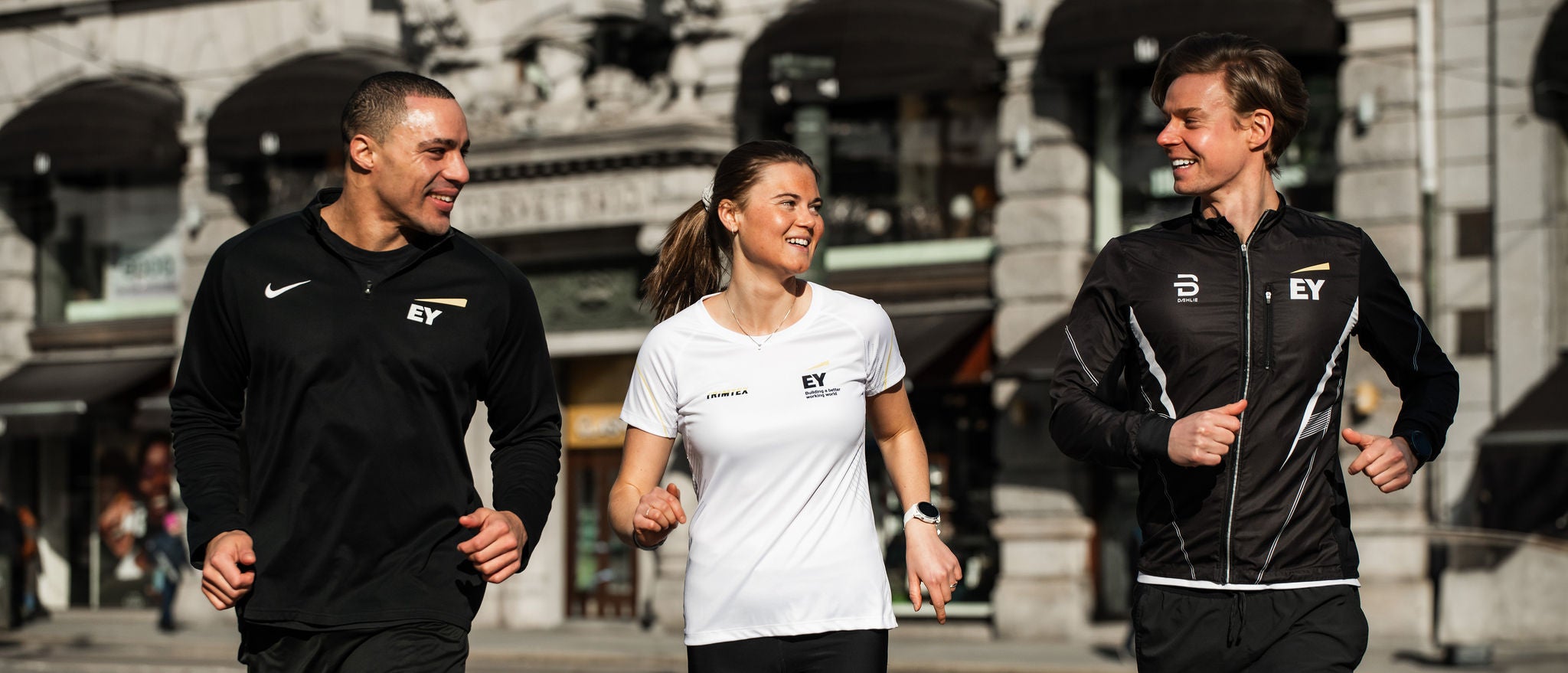 Employees participating in a workplace run through the city.