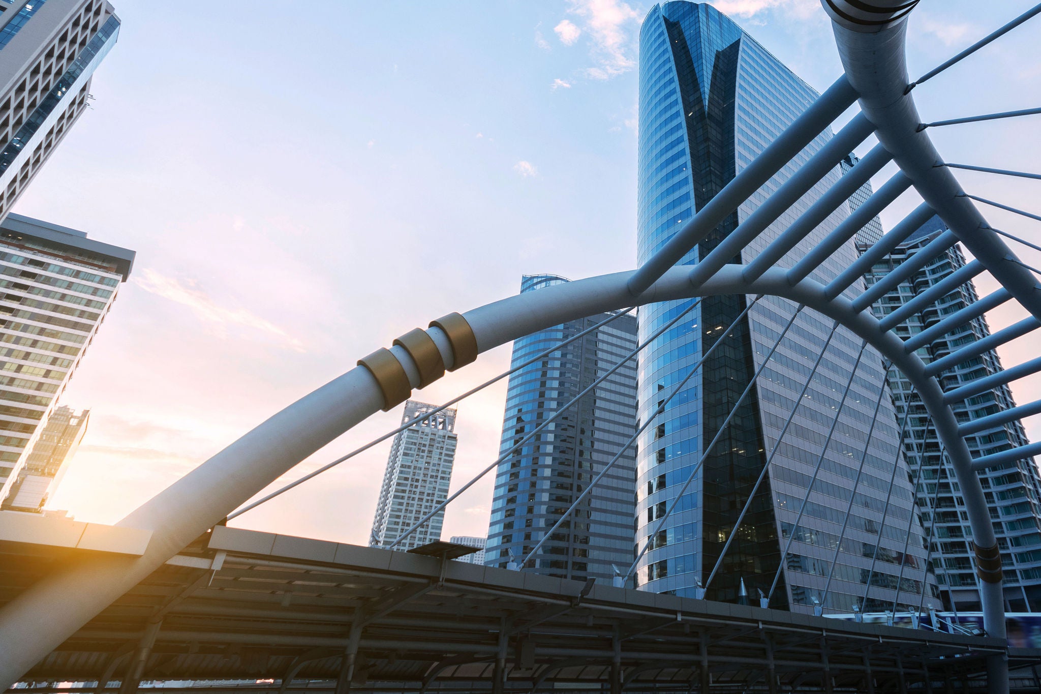 Office building in Sathorn-Silom business district in Bangkok, Thailand as in blue tone and sunset.