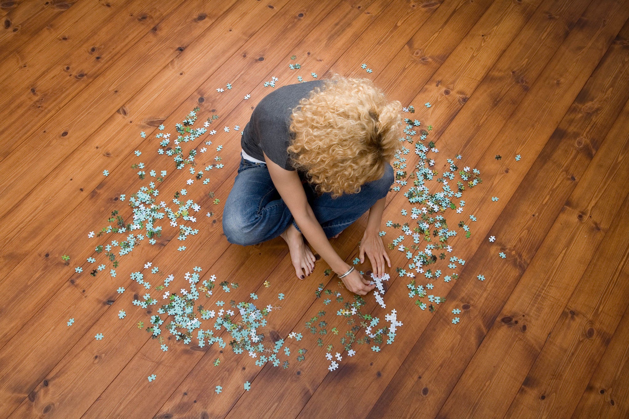 Woman doing jigsaw puzzle