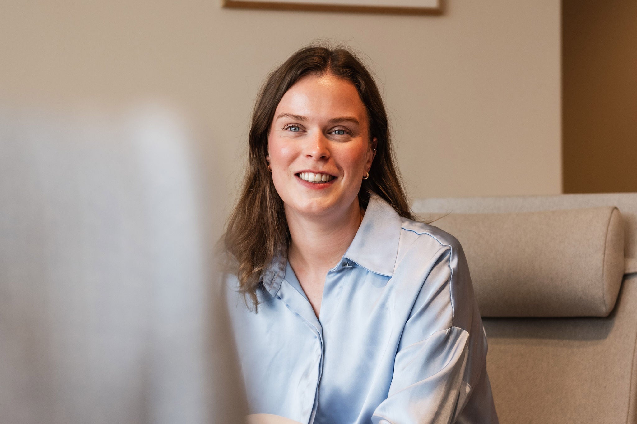 Employee sharing career experiences in a professional setting