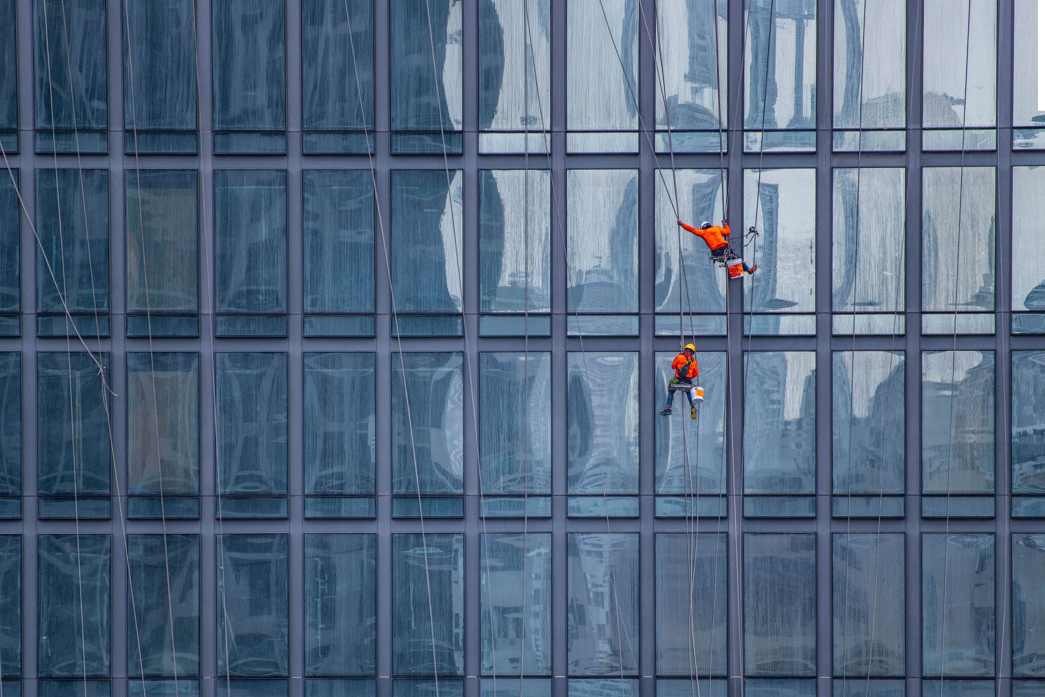 window cleaner's working on facade of high rise building in Bangkok