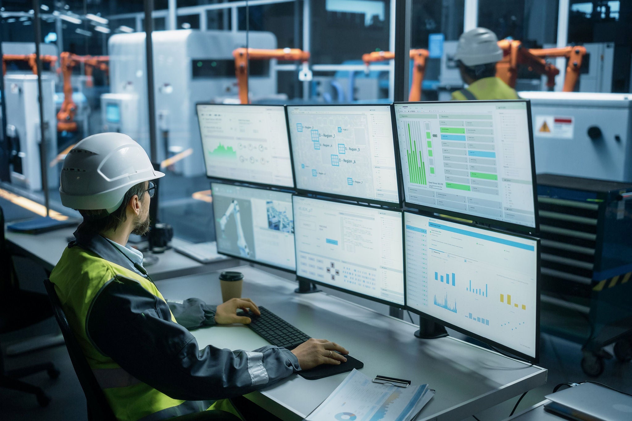 two engineers in a control room