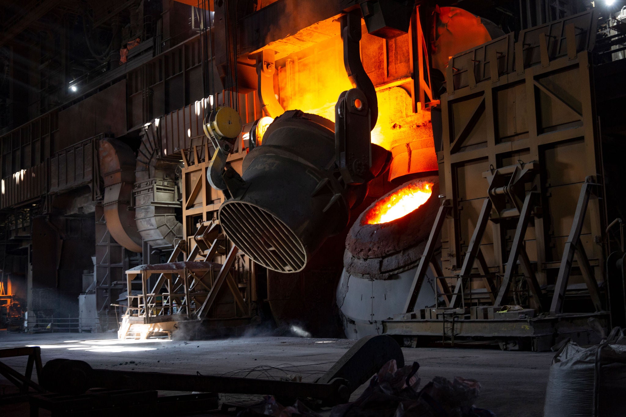 a bucket tilts over a furnace mouth at BSL's Scunthorpe plant