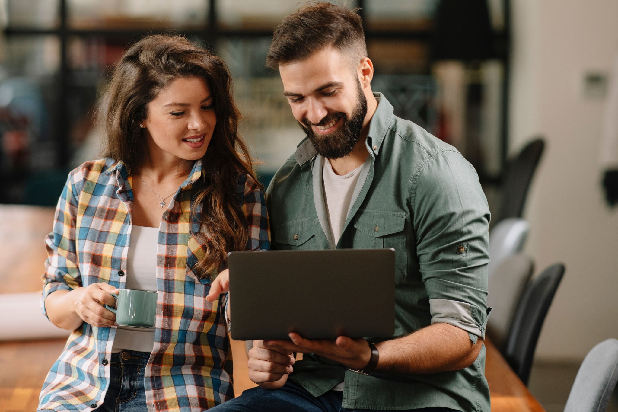 Colleagues in office. Businesswoman and businessman discussing work in office. Two friends in working together.  
