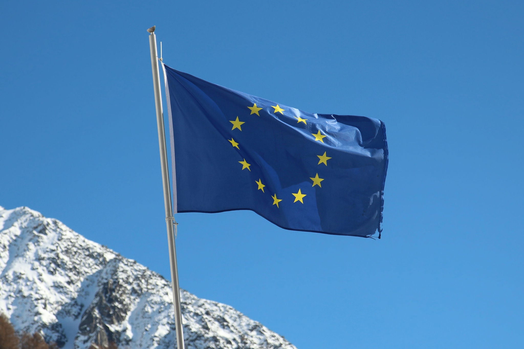EU flag against mountains