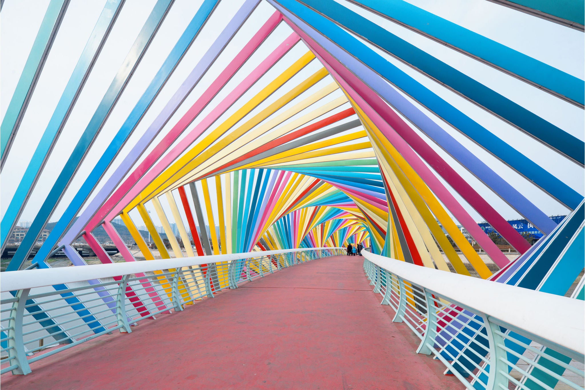 Family poses on the Rainbow Bridge Qingdao City