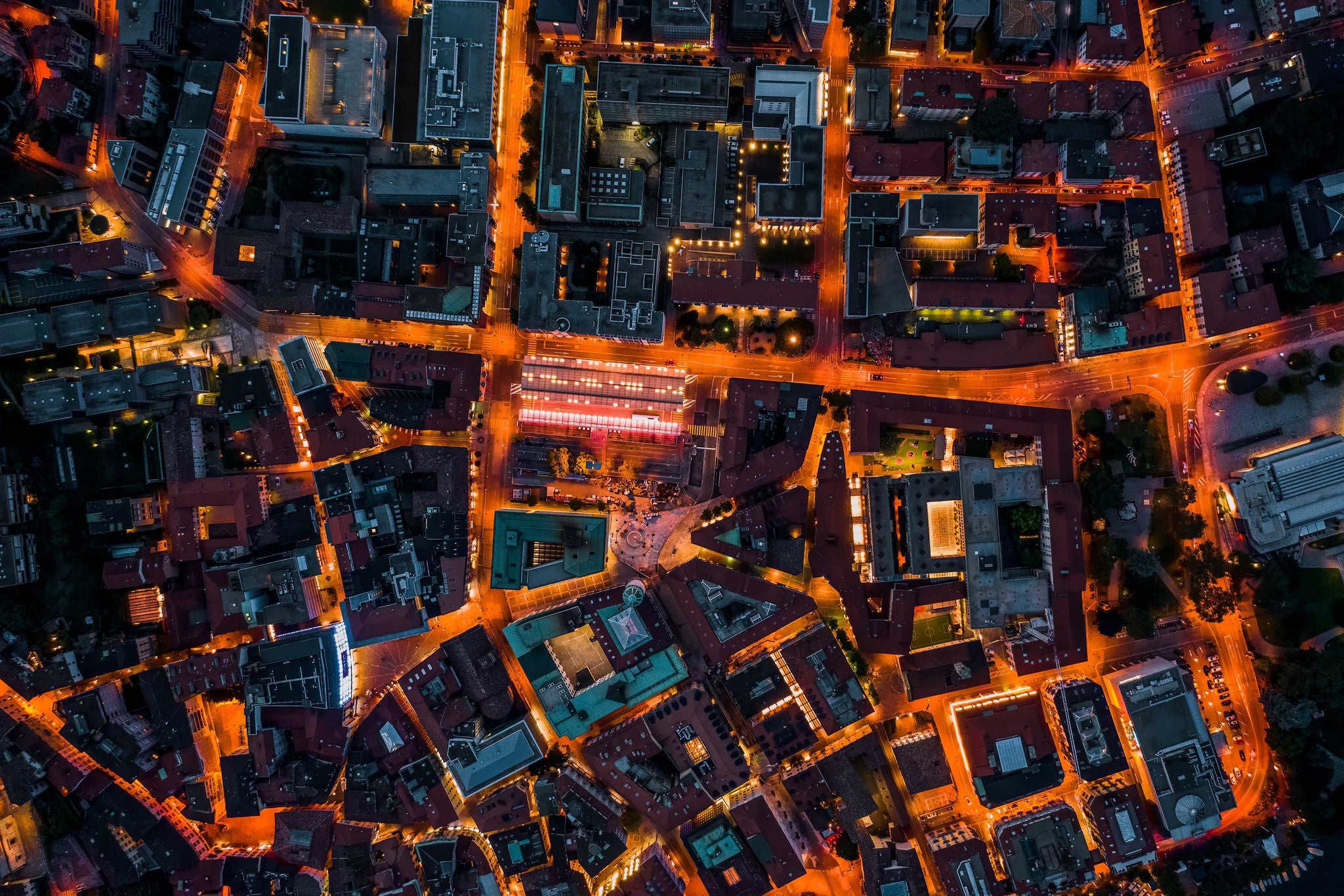 Aerial drone night shot of city street lights in Lugano