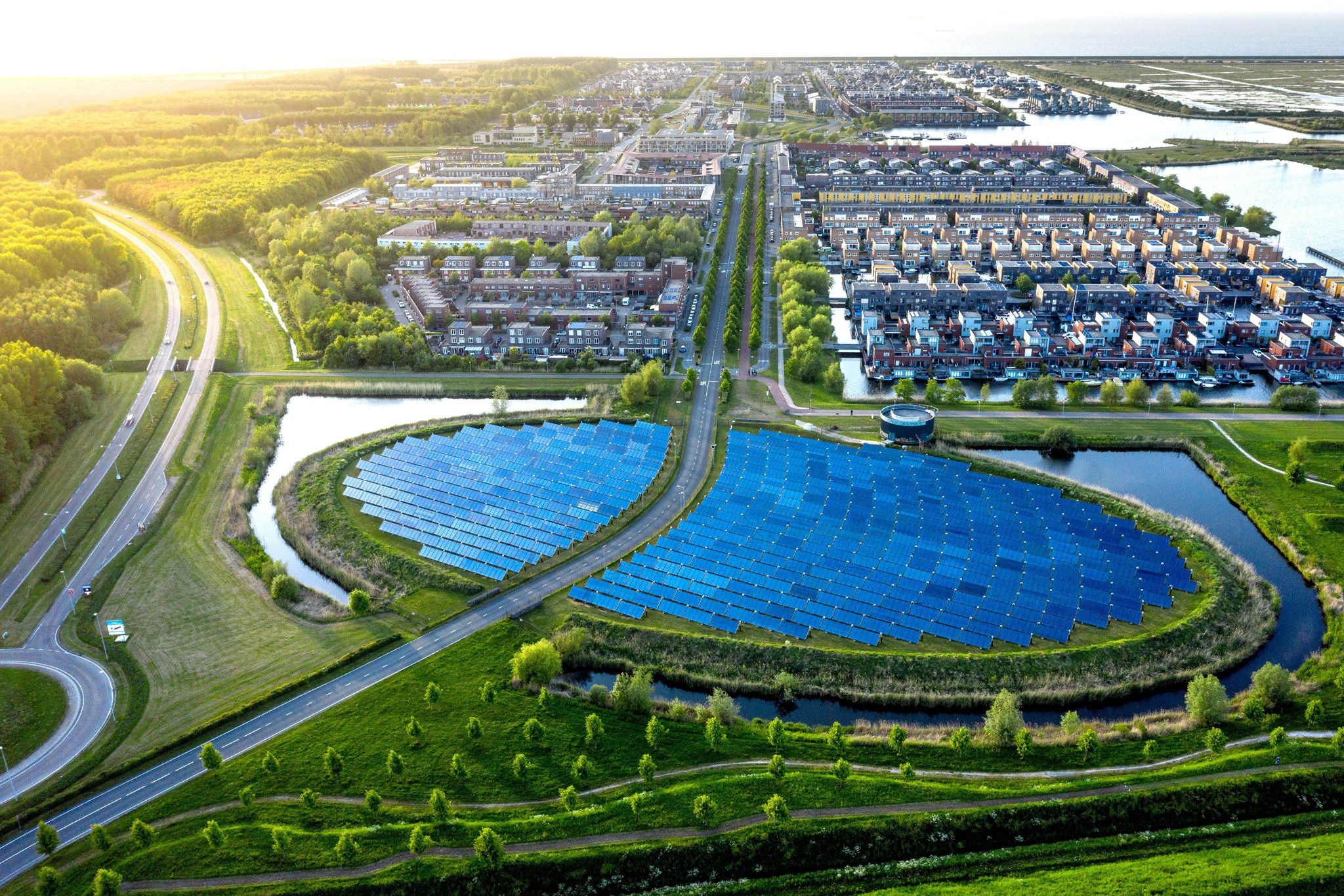 Aerial view of solar panels integrated into a sustainable urban landscape.