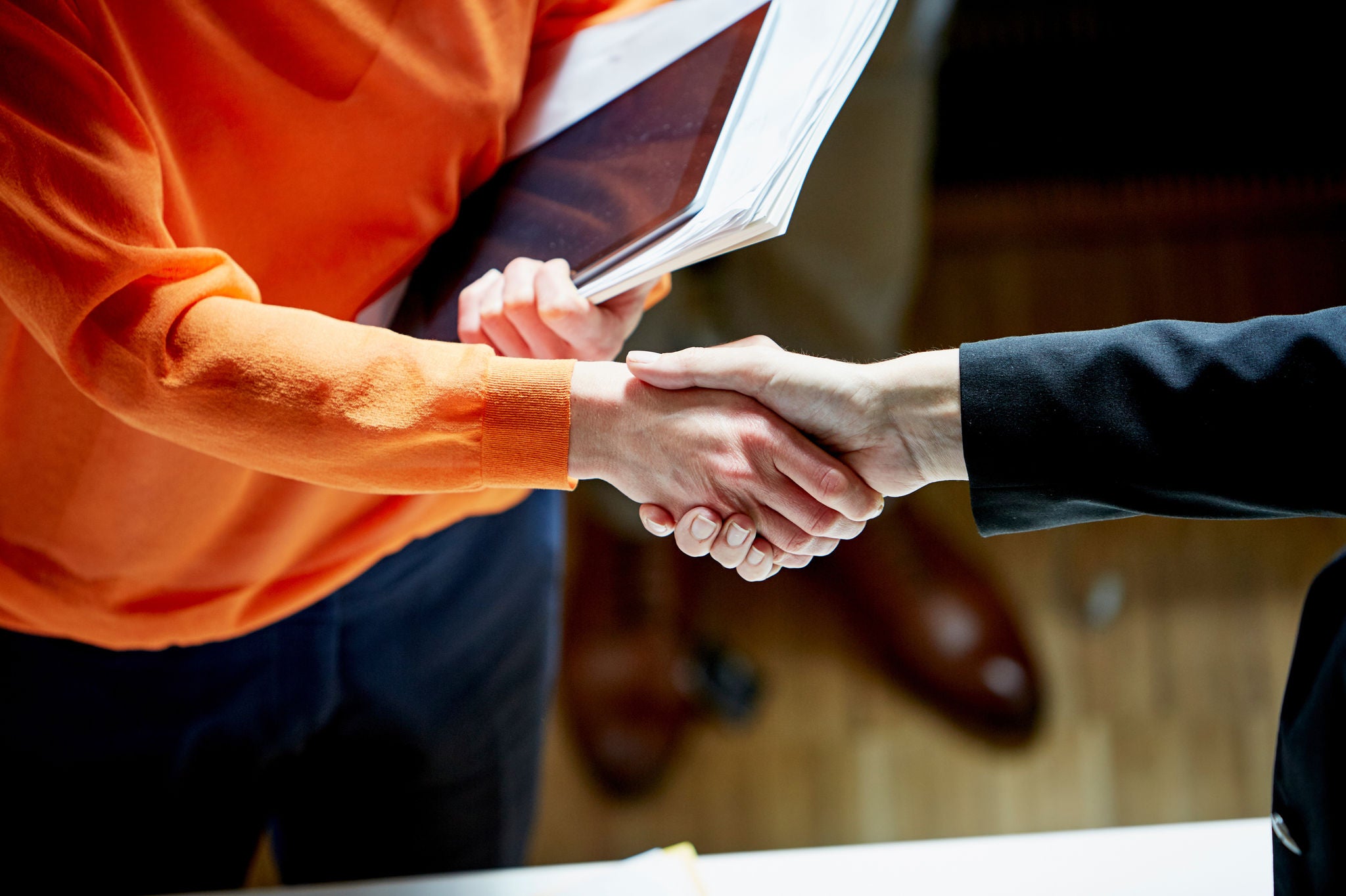 Businesswomen Shaking Hands In Office