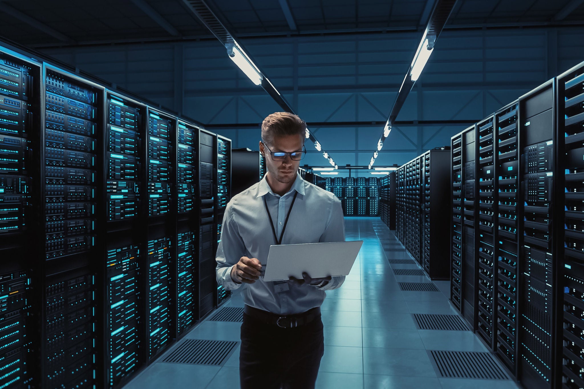 Men with a laptop in data center