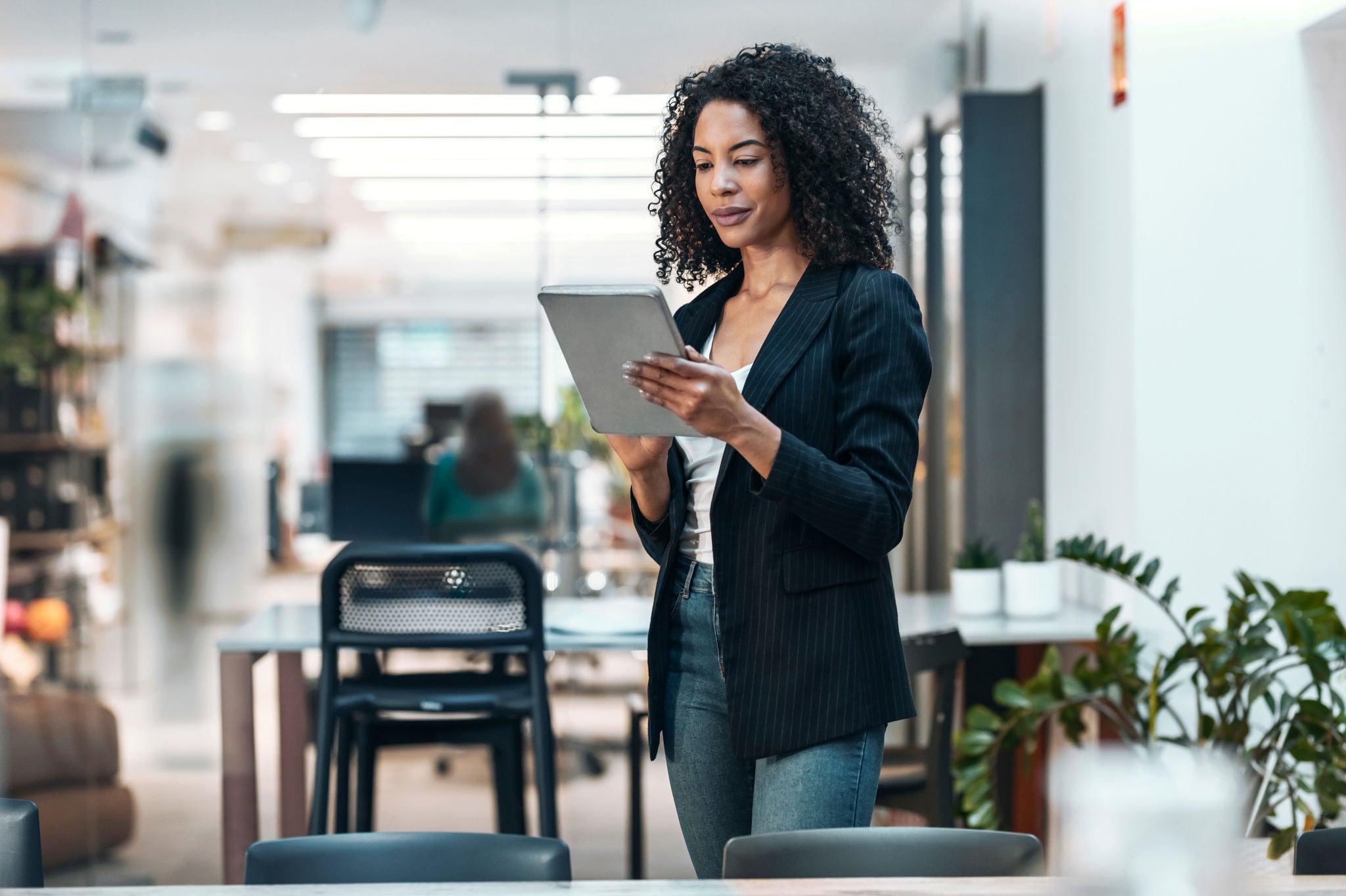 Businesswoman using tablet PC at office
