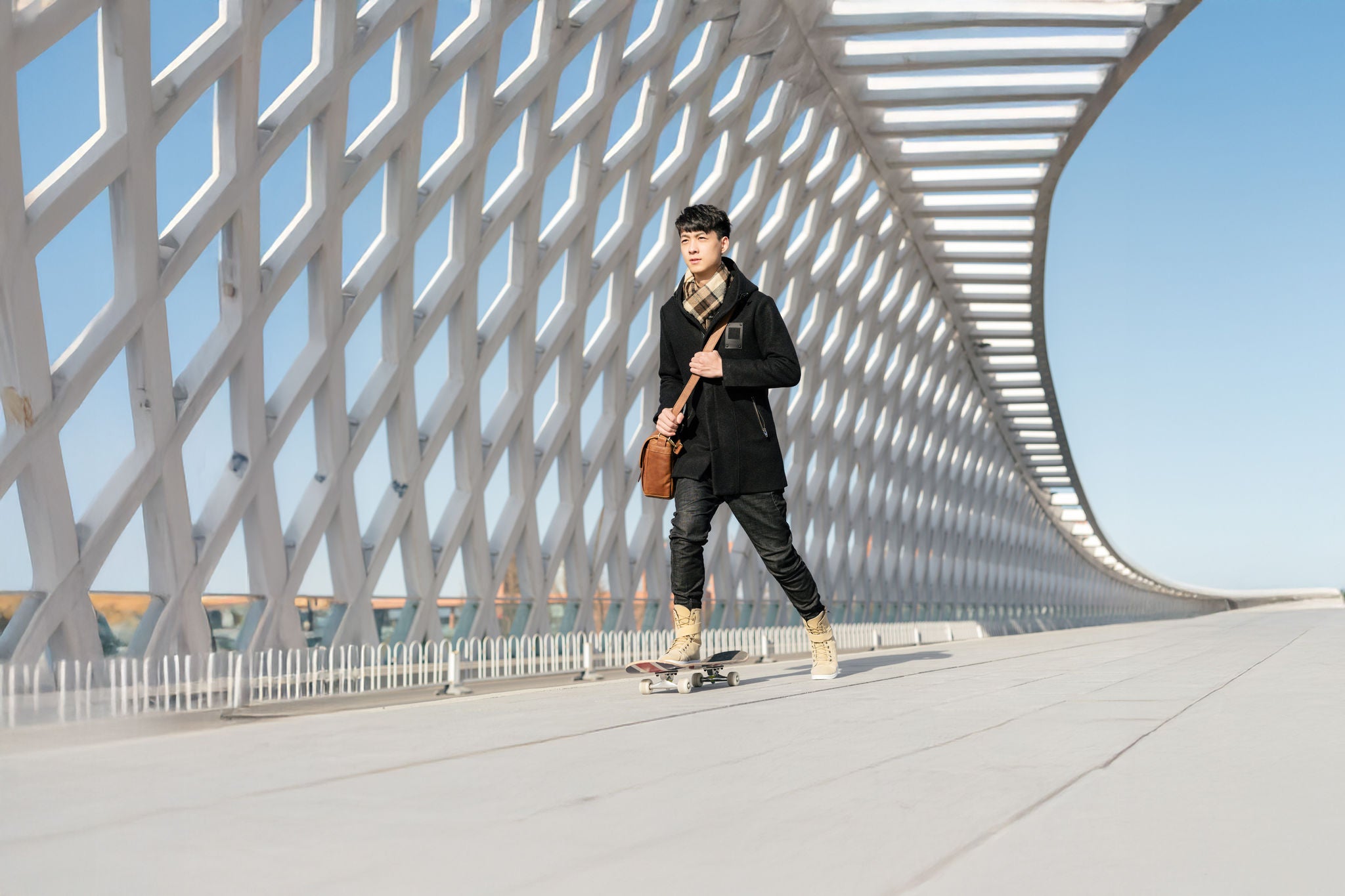 skateboard; activity; adult; autumn; bag; balance; beijing; bridge; business; chinese; city; clear; confidence; confident; day; fashion; fun; handsome; leather; male; man; millennial; motion; one; outdoors; pavement; people; portrait; shoulder bag; skate; skill; sky; sport; street; sunny; sunshine; teenager; winter; young; youth; east asian; boy; person; teenagers; young person; young people; adolescent; adolescents; youths; minor; minors; juvenile; juveniles; teen; teens; youngster; youngsters