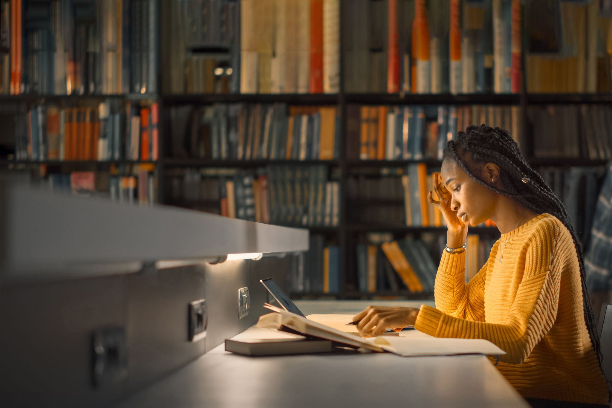 Black women studying in library