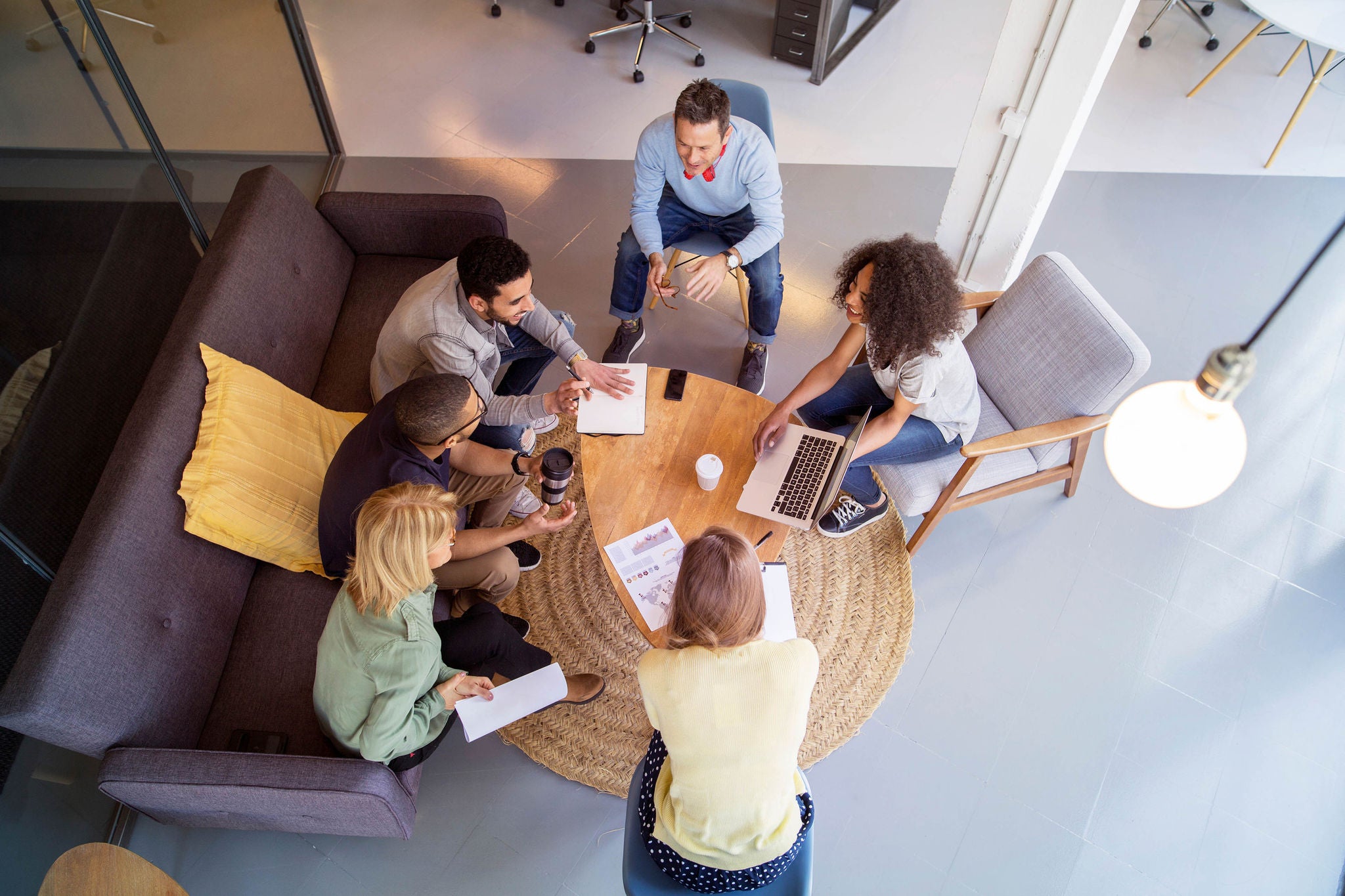 High angle view of business people discussing in meeting at office
