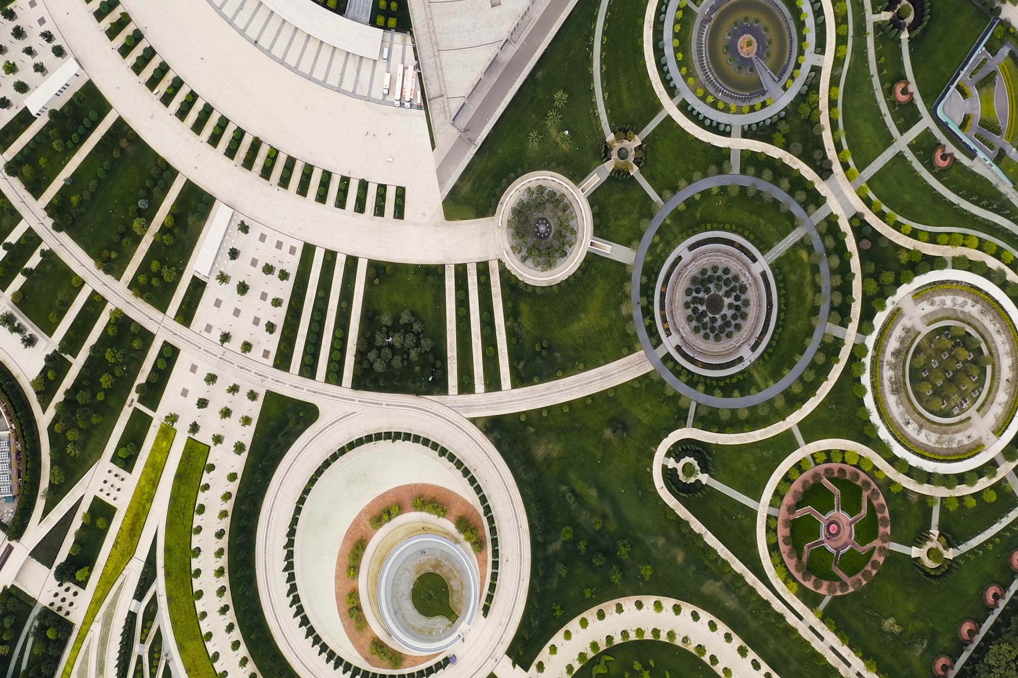 Aerial view of a landscaped garden featuring concentric circular designs