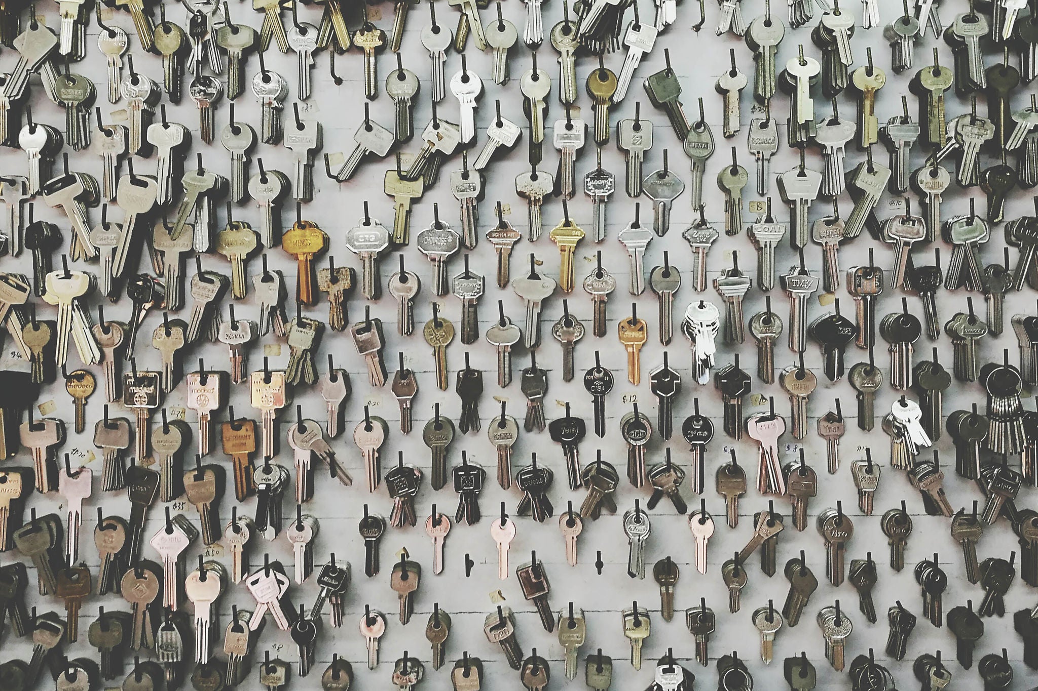 Full frame shot of hundreds of keys hanging on the wall in locksmith's shop
