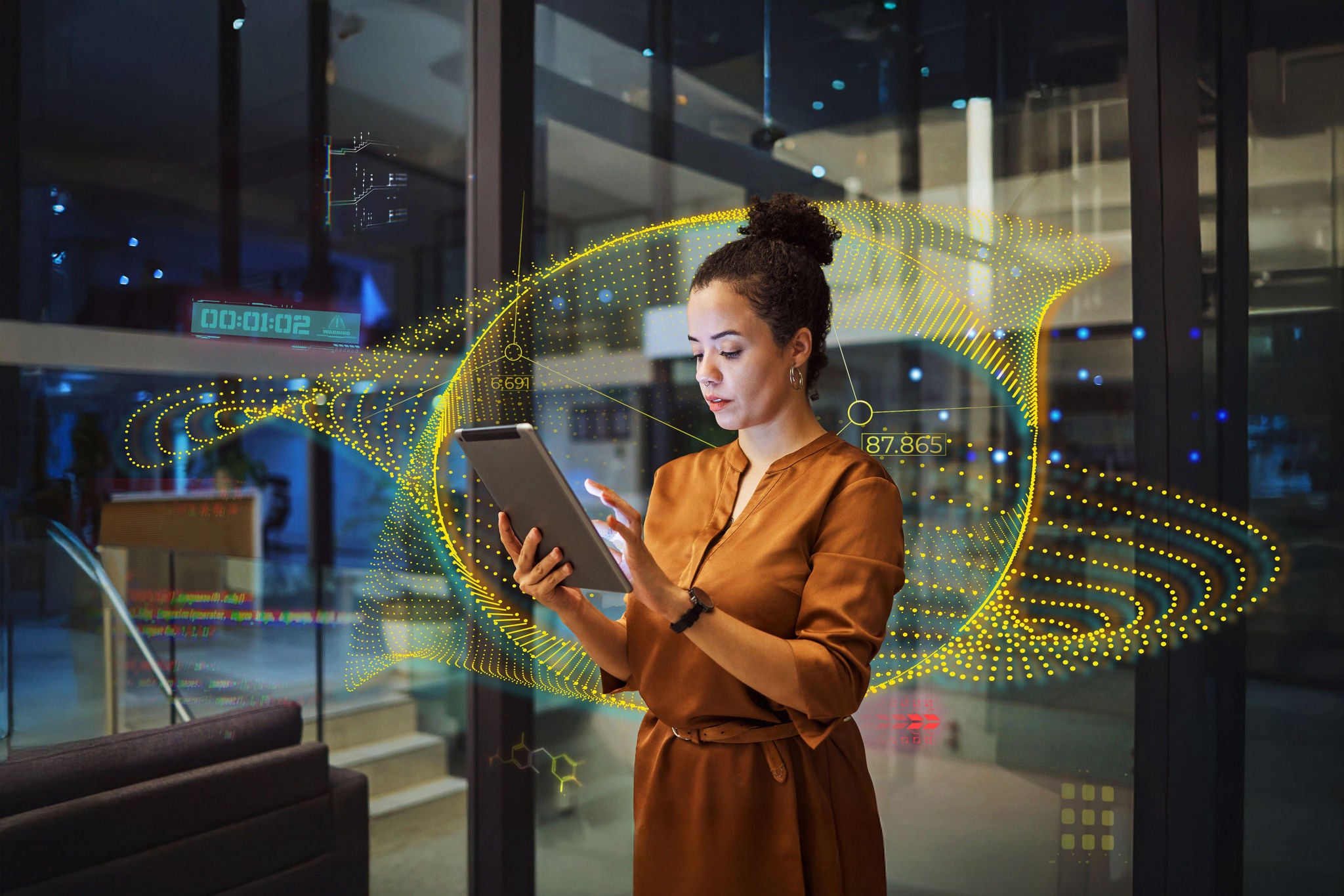 EY business woman in front of glass windows