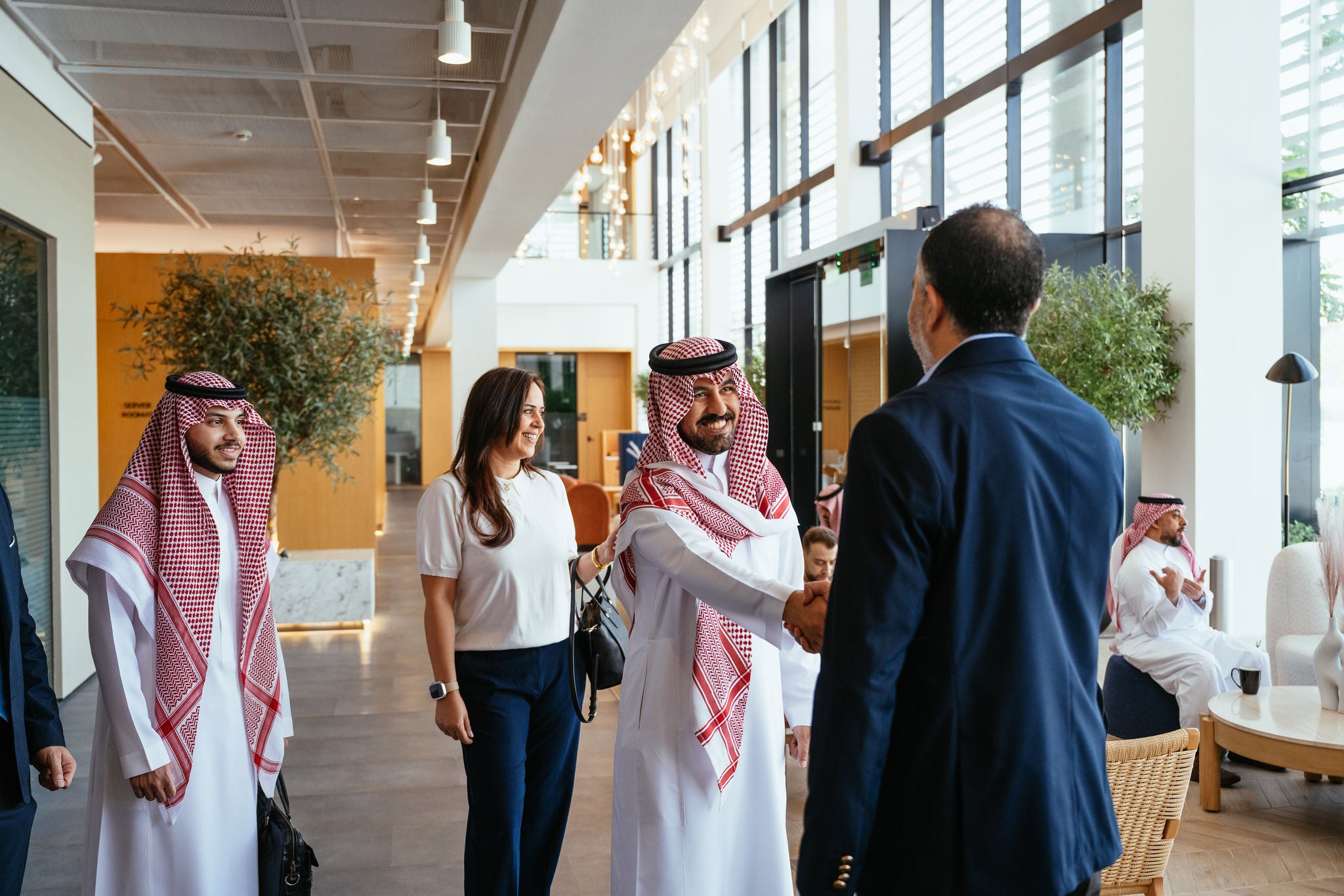 Business Meeting in Modern Office Lobby