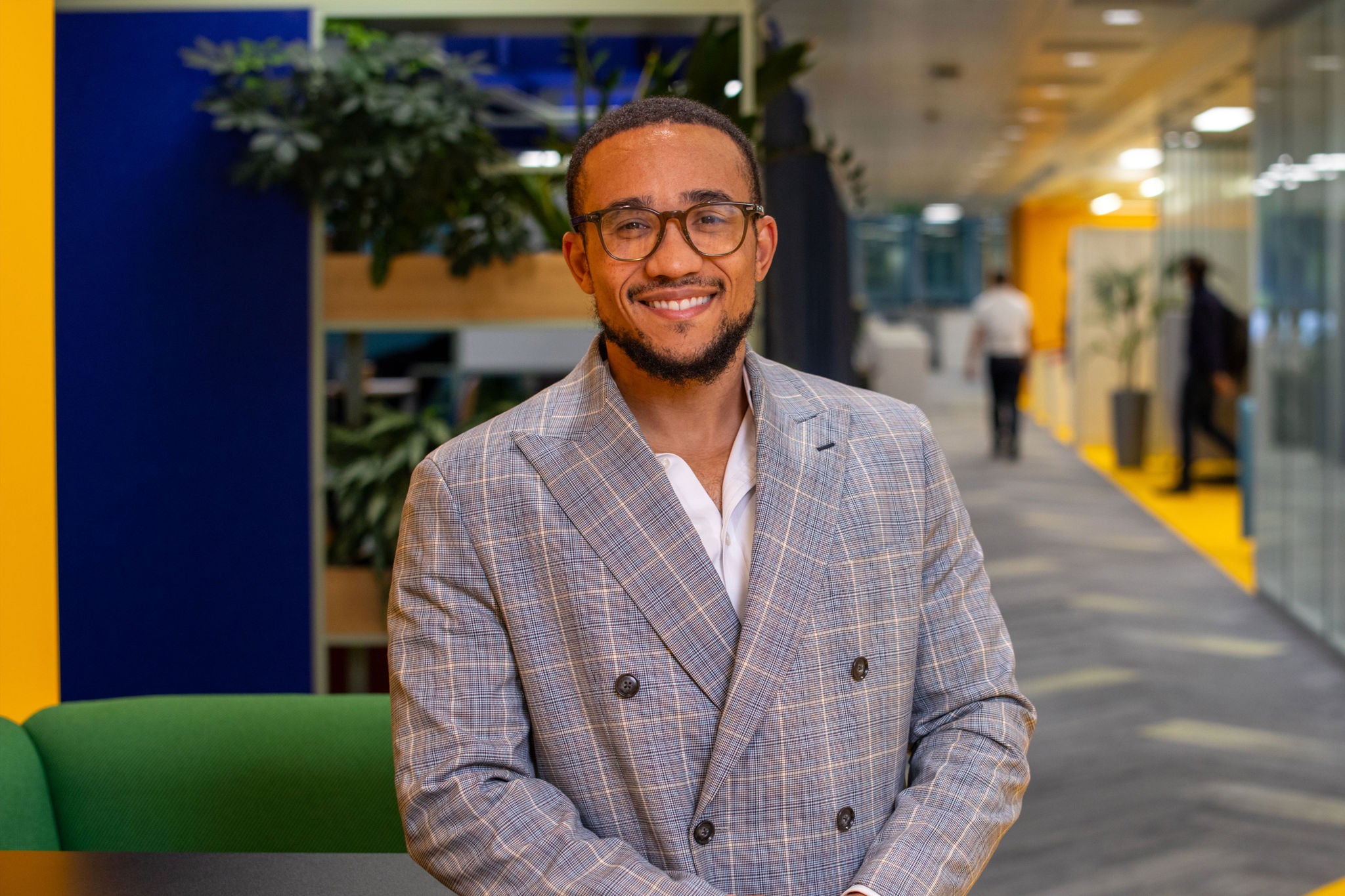Person standing in the office smiling