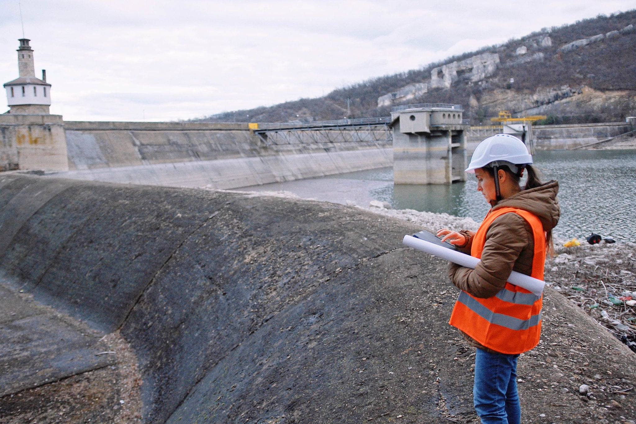 EY Female Engineer Working in Hydroelectric Dam