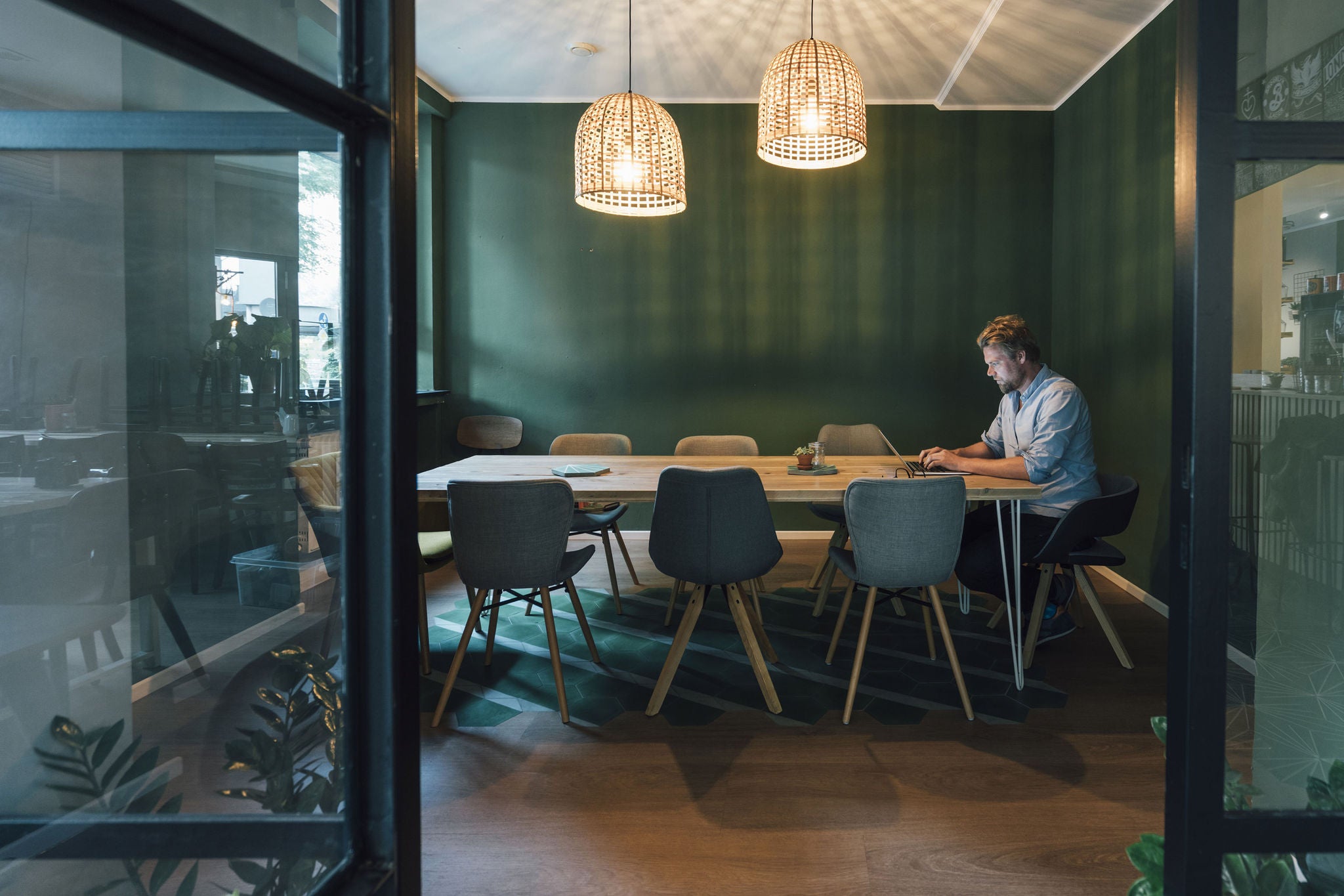 - Man sitting in office, working late in his start-up company