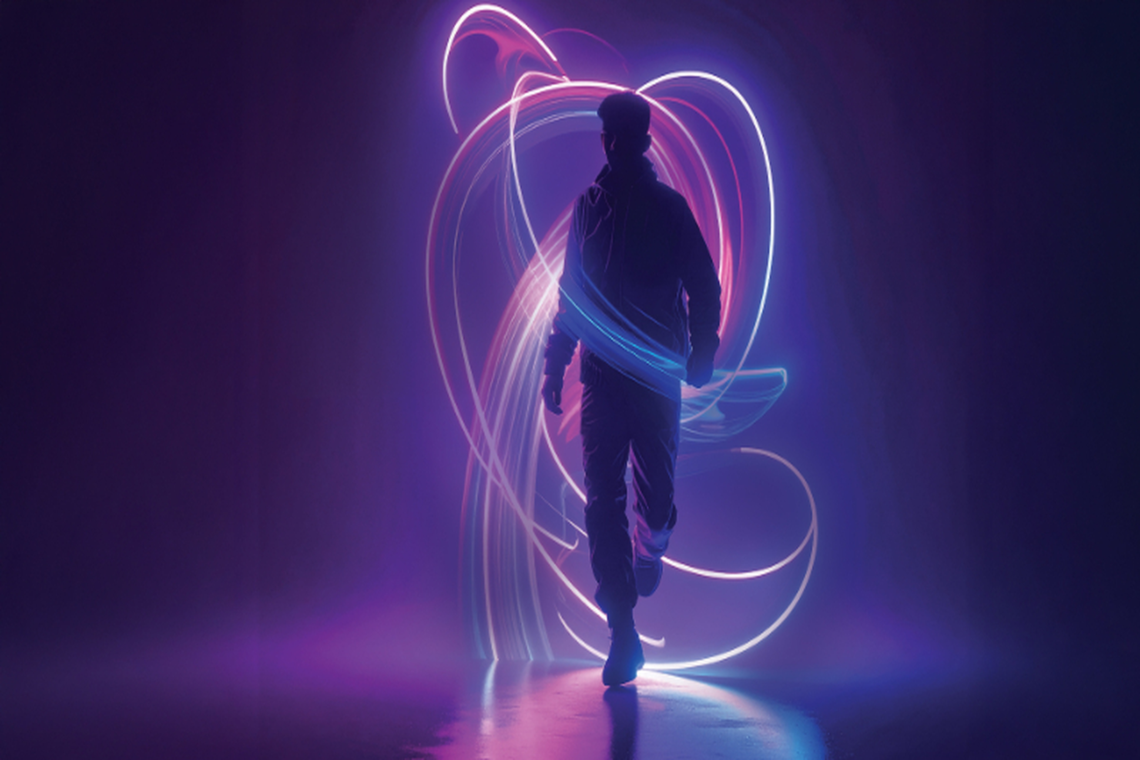 Silhouette against swirling neon lights