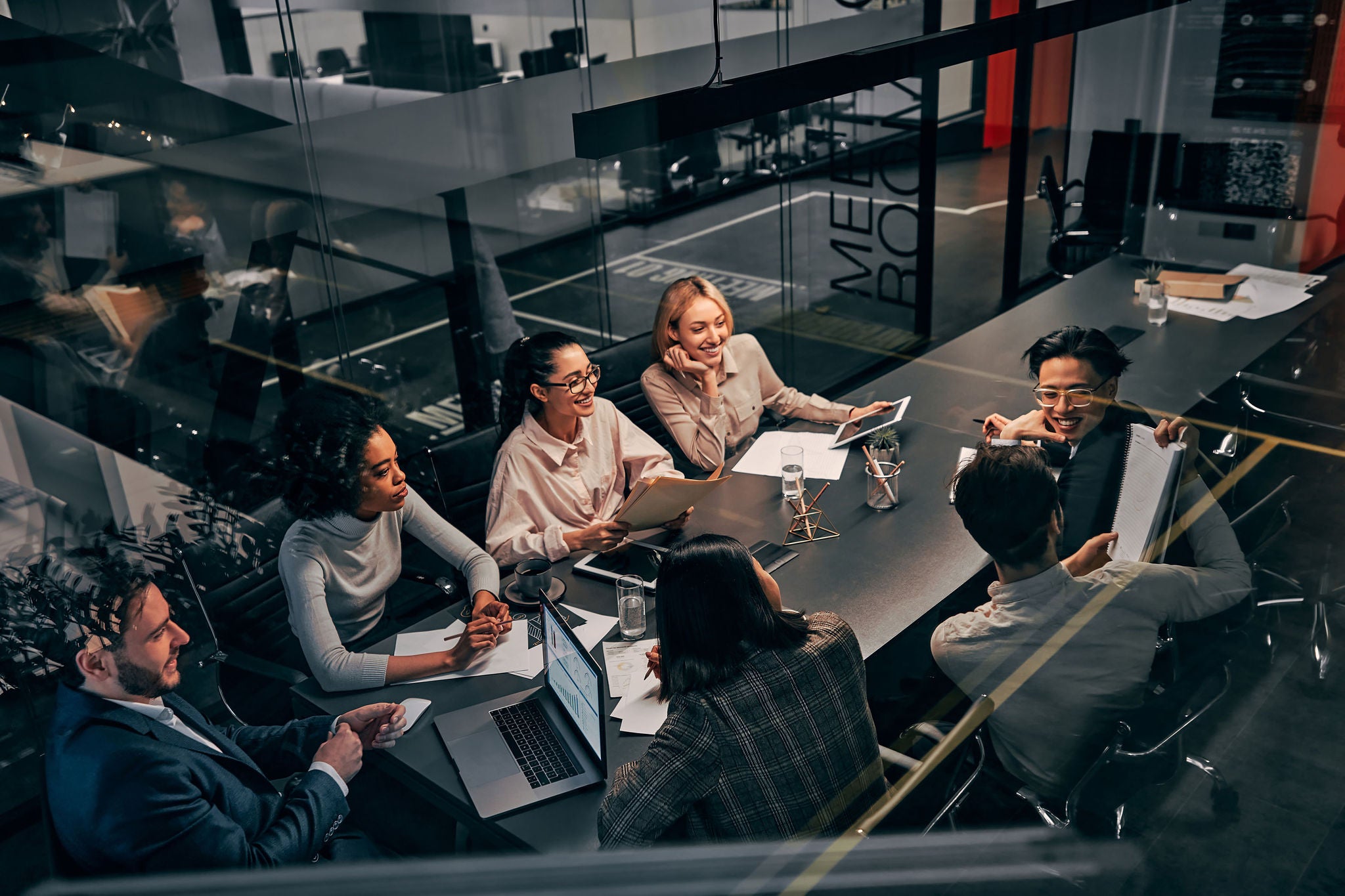 business team working in an office communicating and discussing work