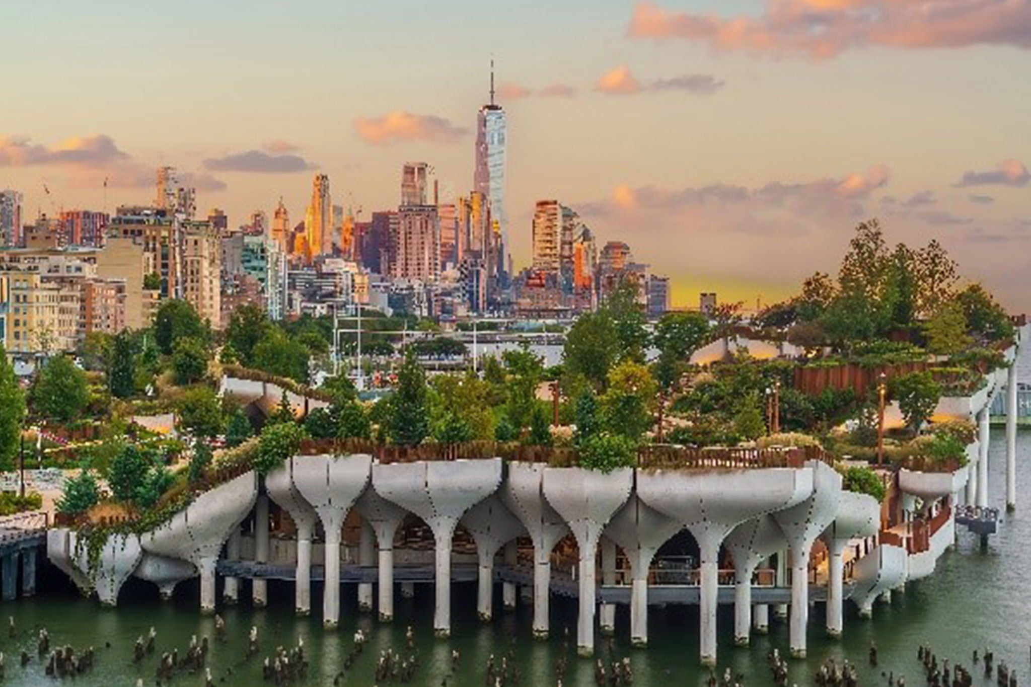 Elevated waterfront park with city skyline