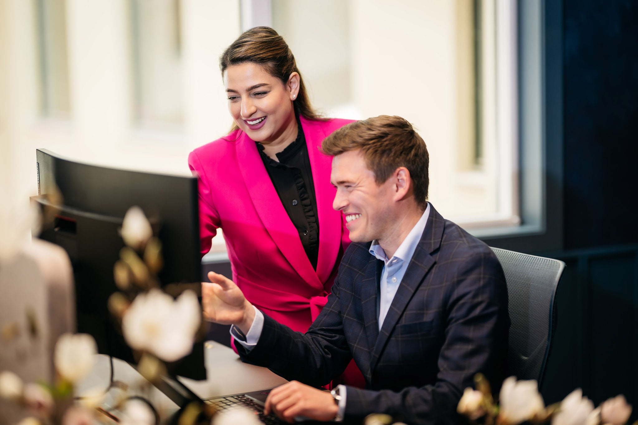 Colleagues collaborating at a workspace