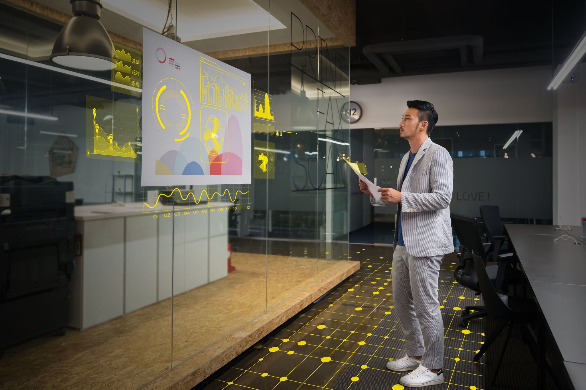 Businessman watching a creative graph in modern office