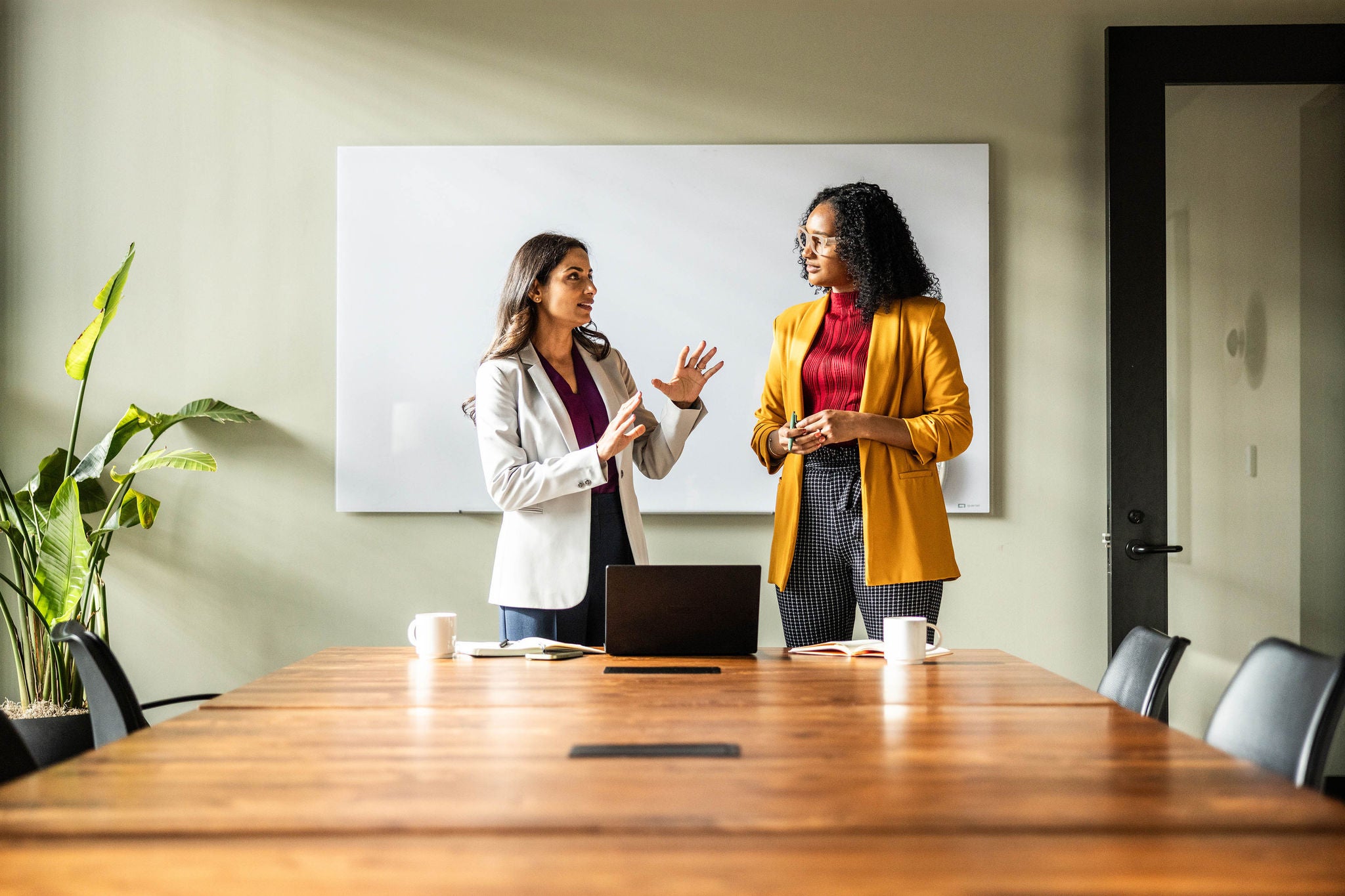 Businesswomen having discussion in modern office room